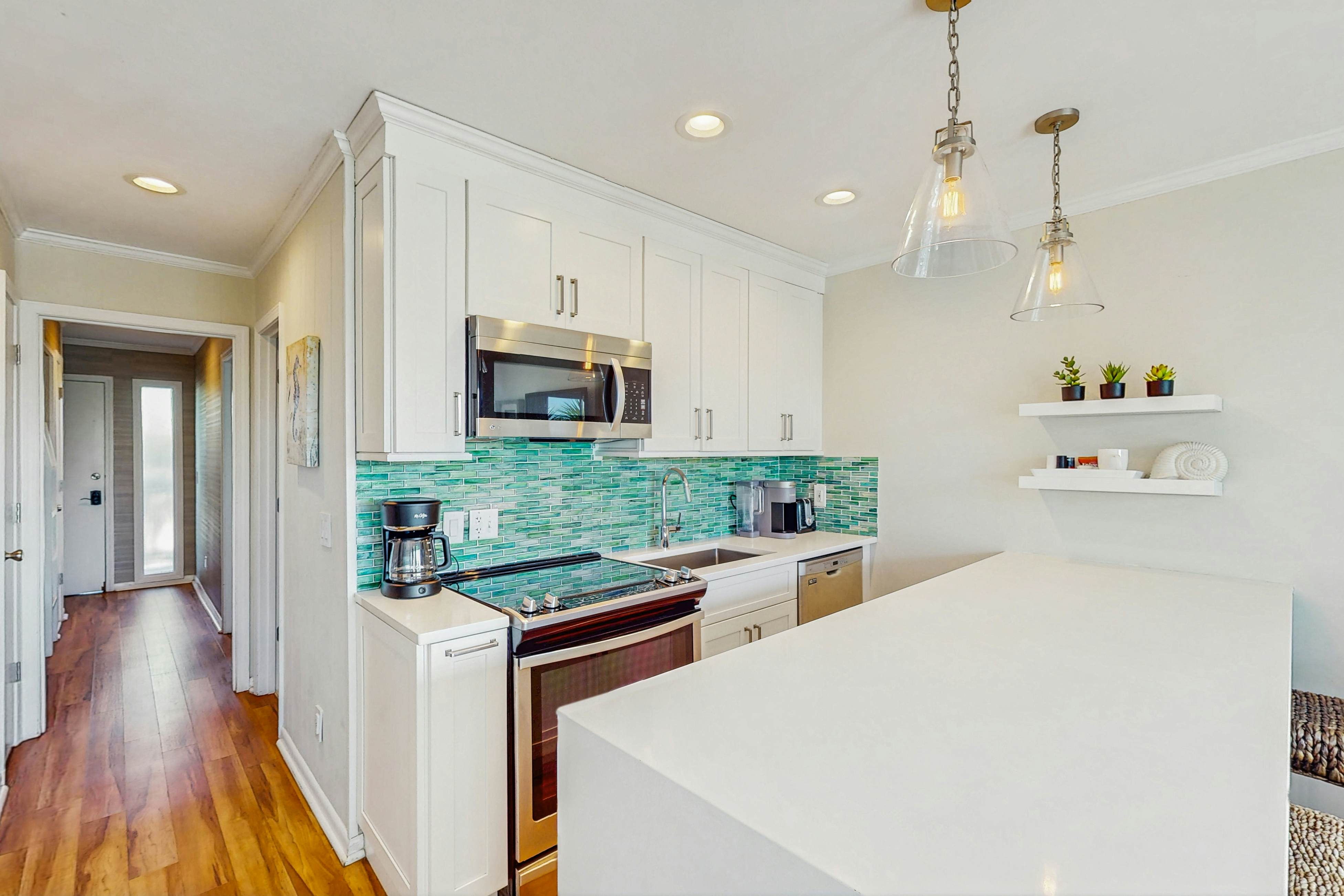 Oceanfront condo with water views, pool, balcony, & easy beach access