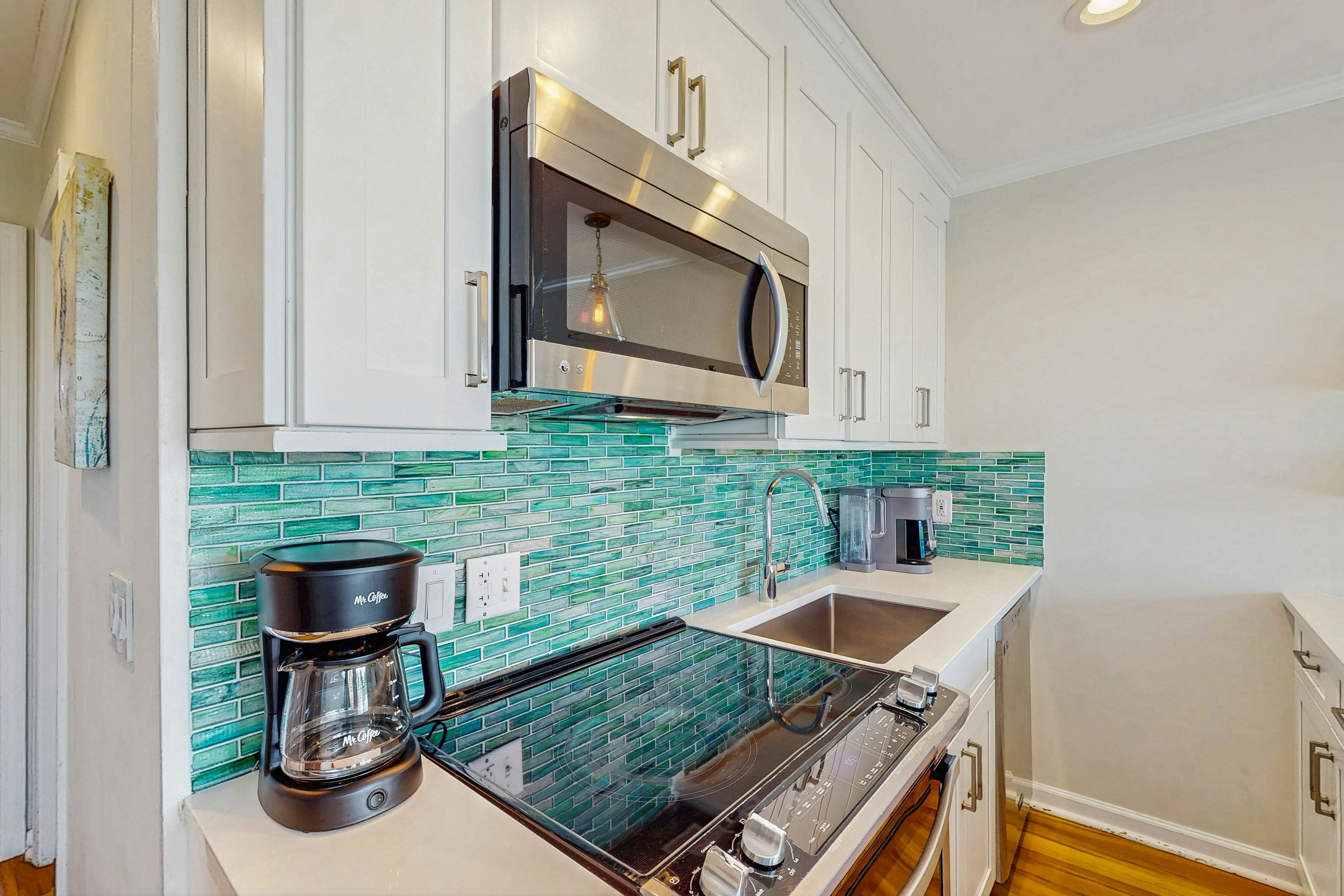 Oceanfront condo with water views, pool, balcony, & easy beach access