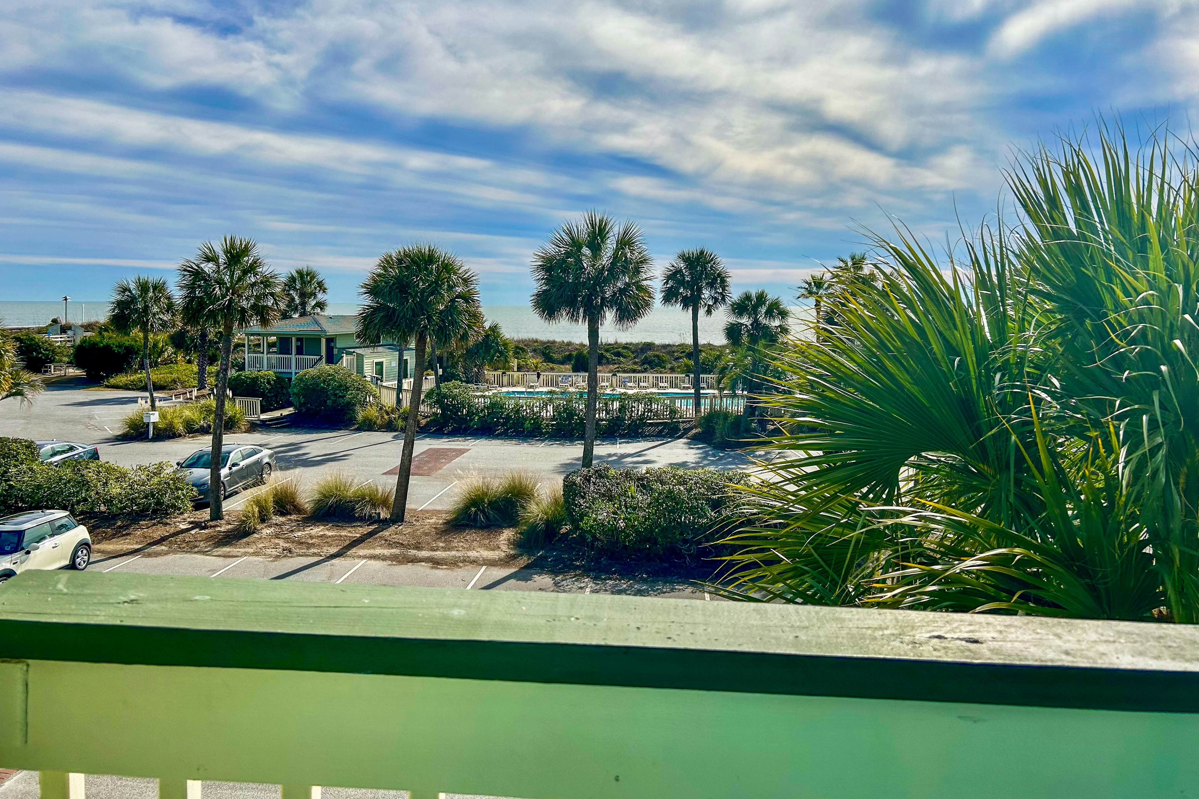 Oceanfront condo with water views, pool, balcony, & easy beach access