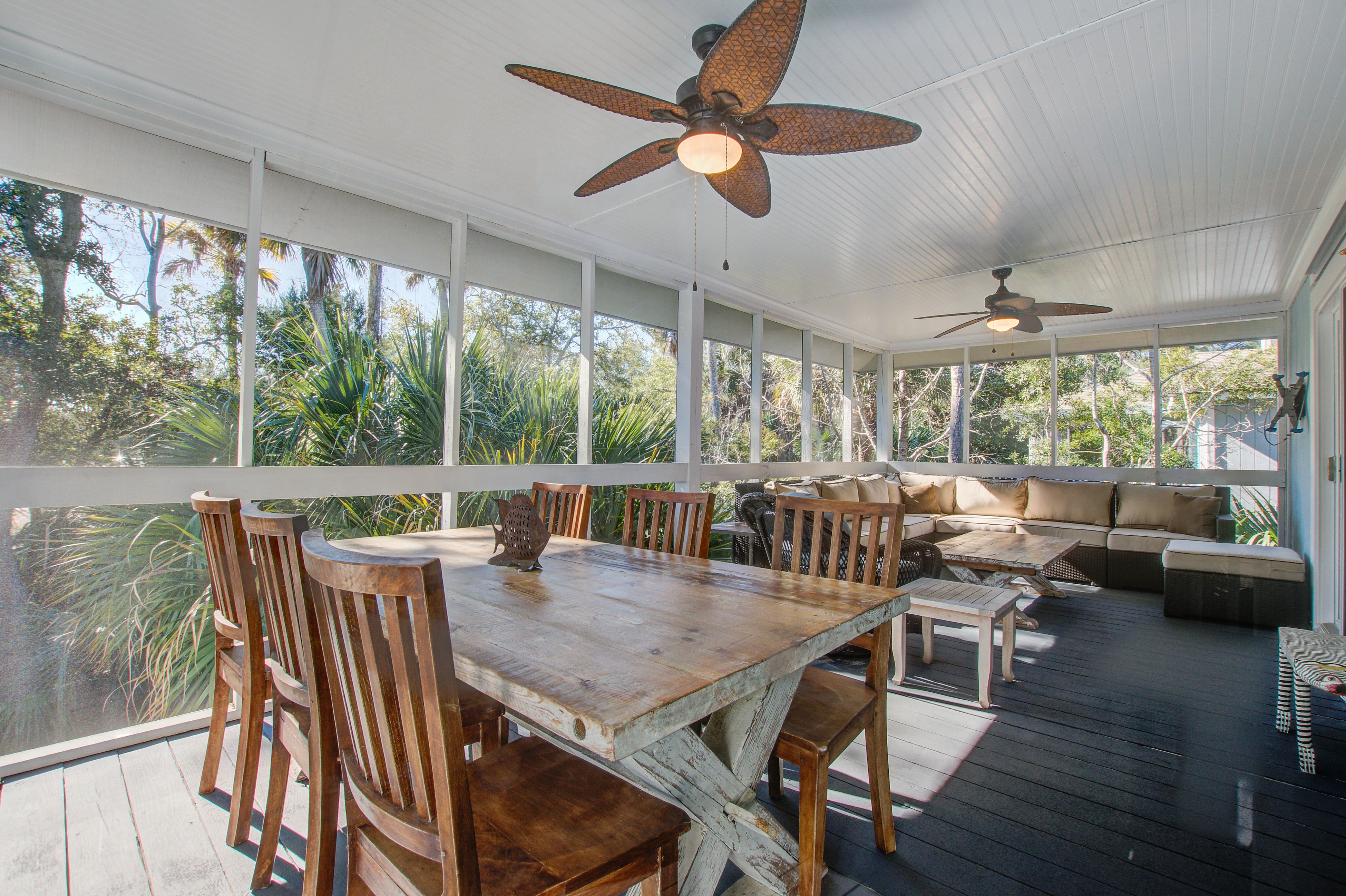 Palm-surrounded abode with screened-in balcony, chef's kitchen, smart TVs, & W/D