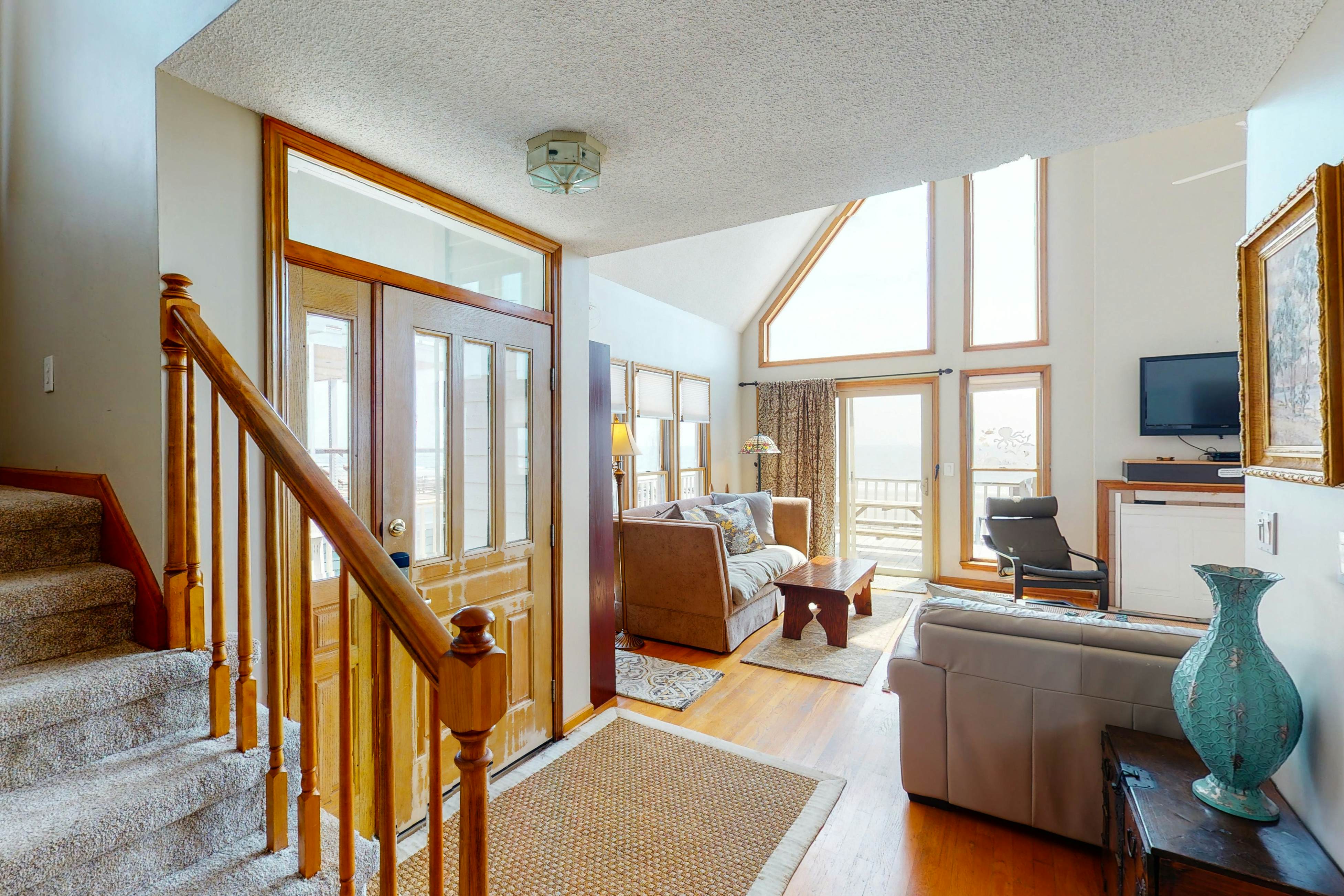 Oceanfront home with stunning ocean views, central AC, and private W/D