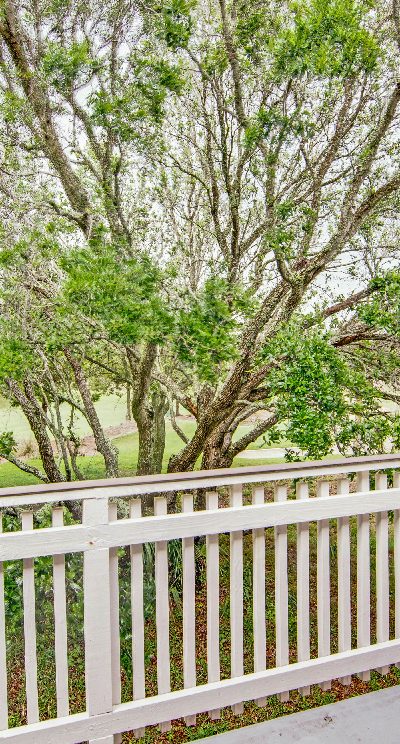 Renovated townhome next to golf course w/ community pool access- close to beach