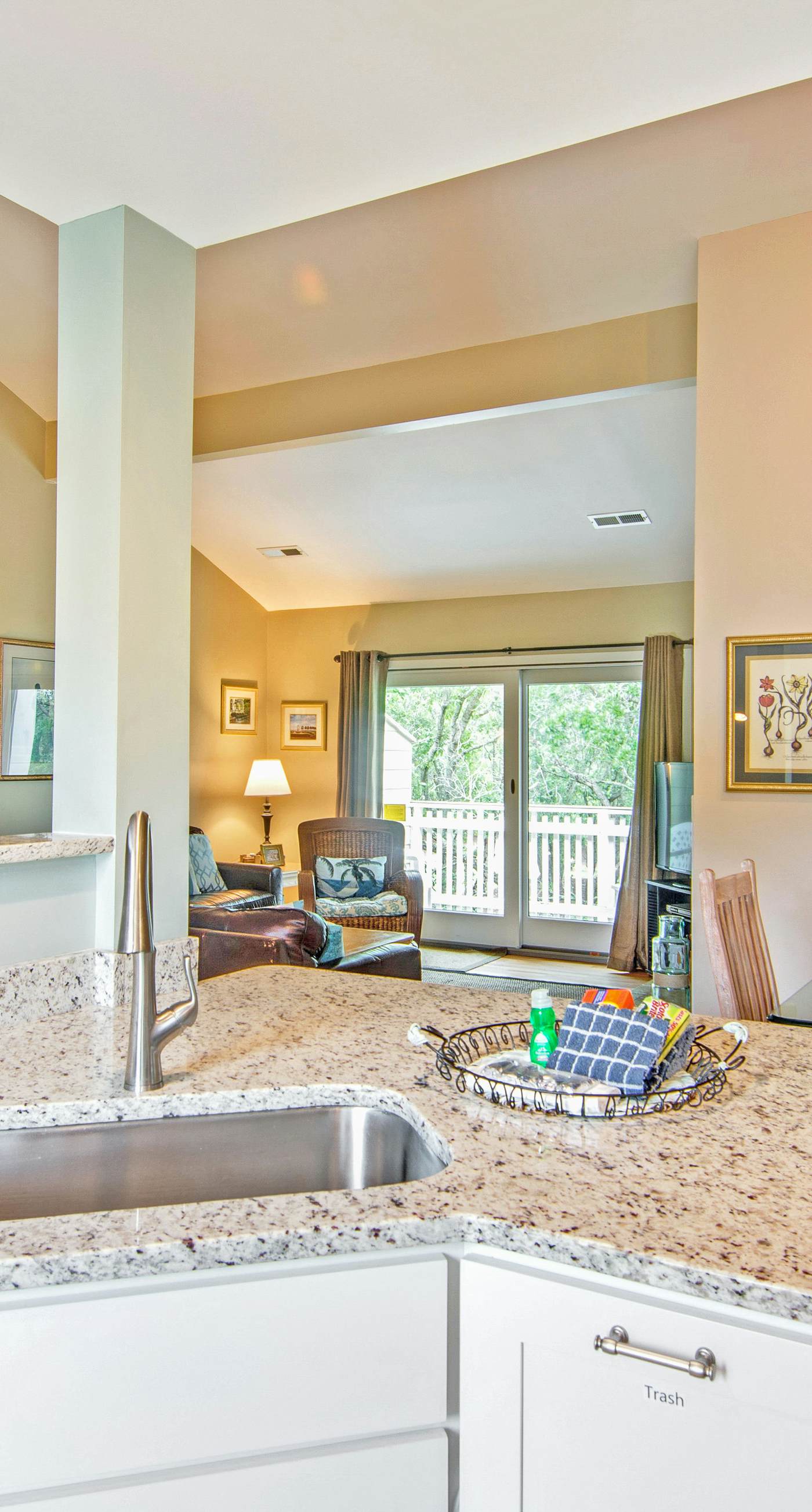 Renovated townhome next to golf course w/ community pool access- close to beach