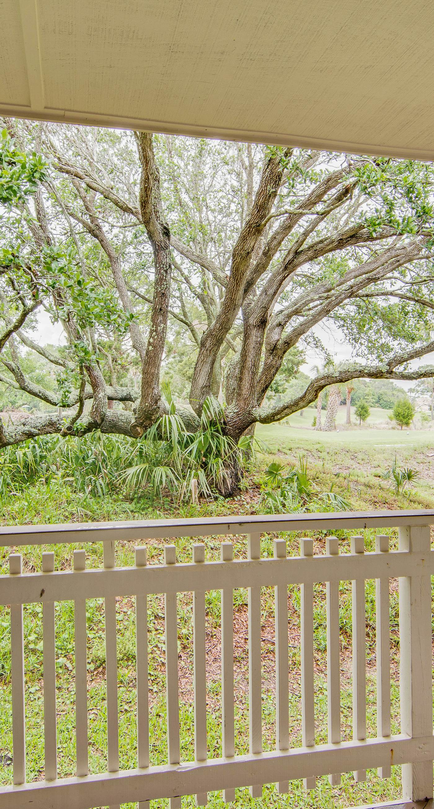 Renovated townhome next to golf course w/ community pool access- close to beach