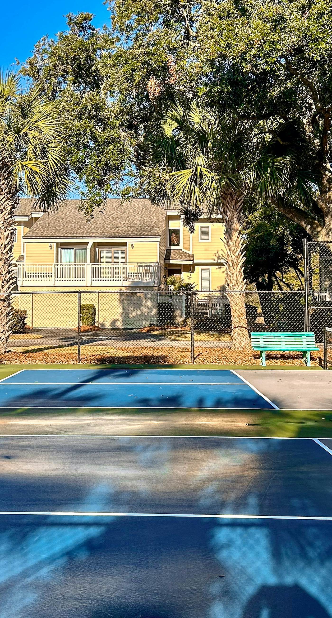 Renovated townhome next to golf course w/ community pool access- close to beach