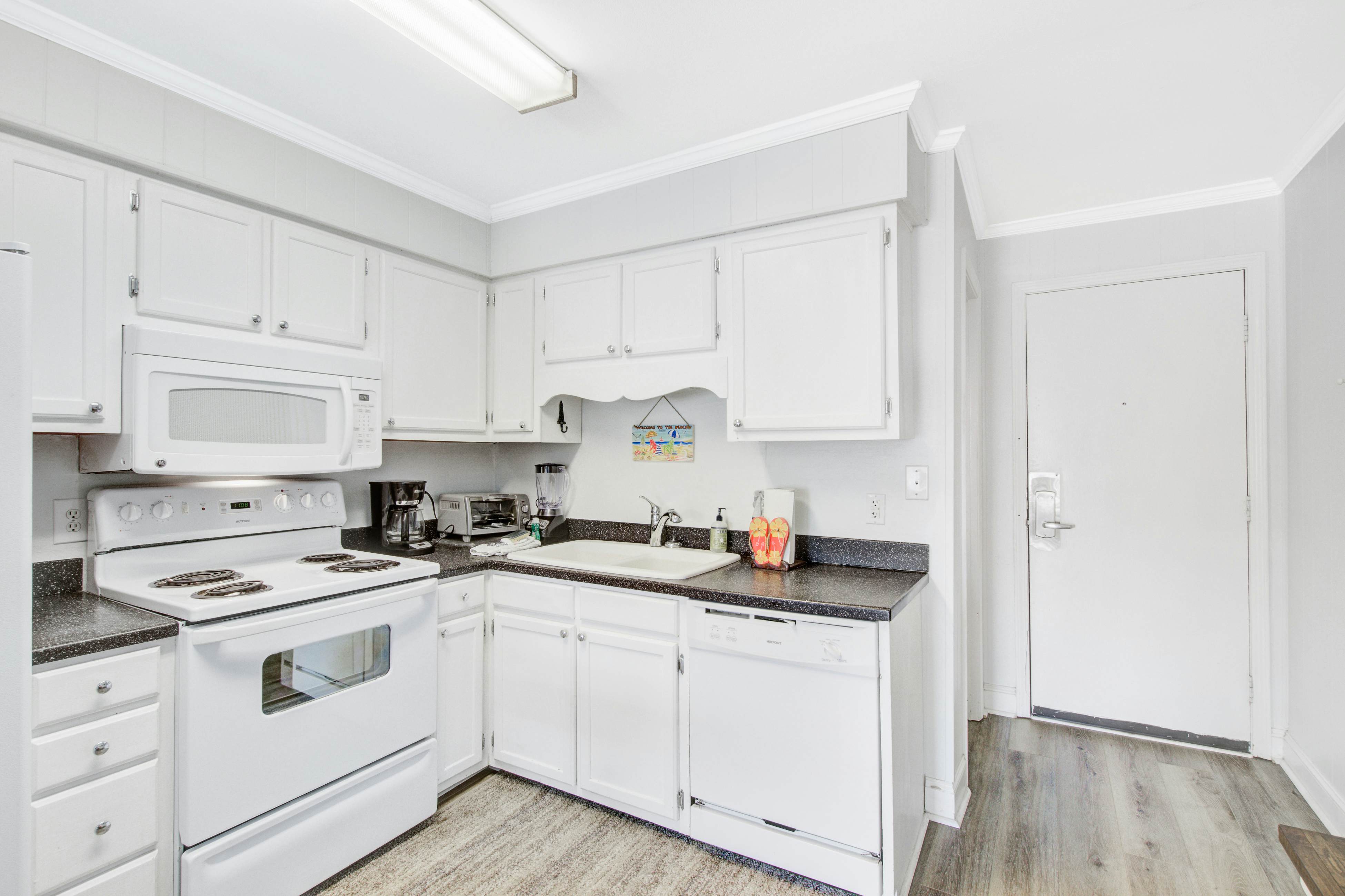 Comfortable villa one row away from the beach w/shared pool & grills