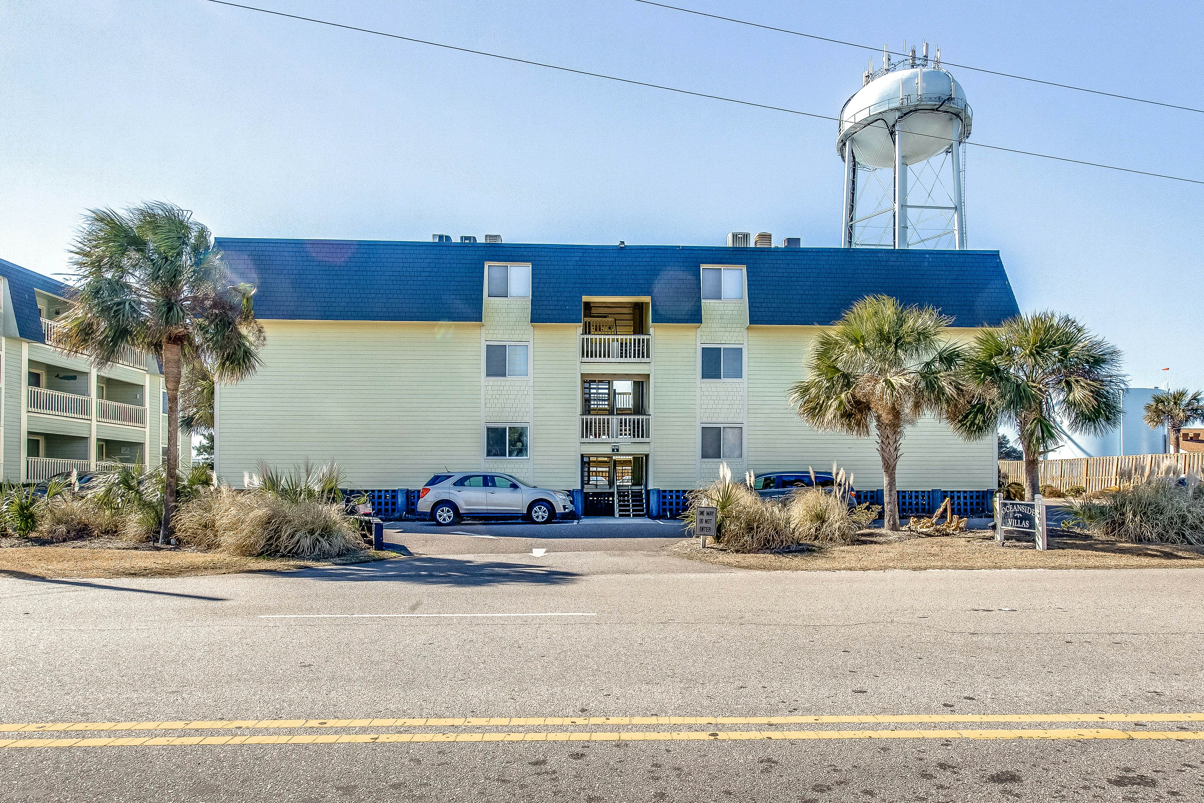 Comfortable villa one row away from the beach w/shared pool & grills