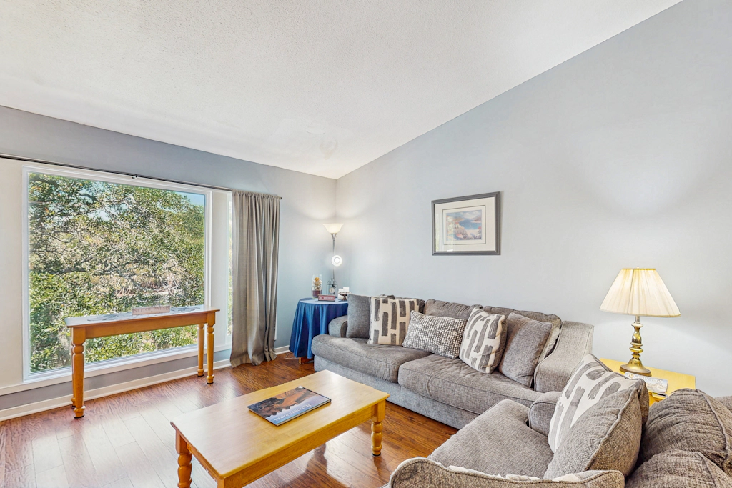 Quaint top floor lagoon view condo w/ community pool access - walk to the beach