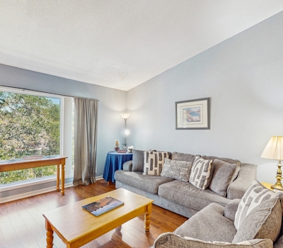 Quaint top floor lagoon view condo w/ community pool access - walk to the beach