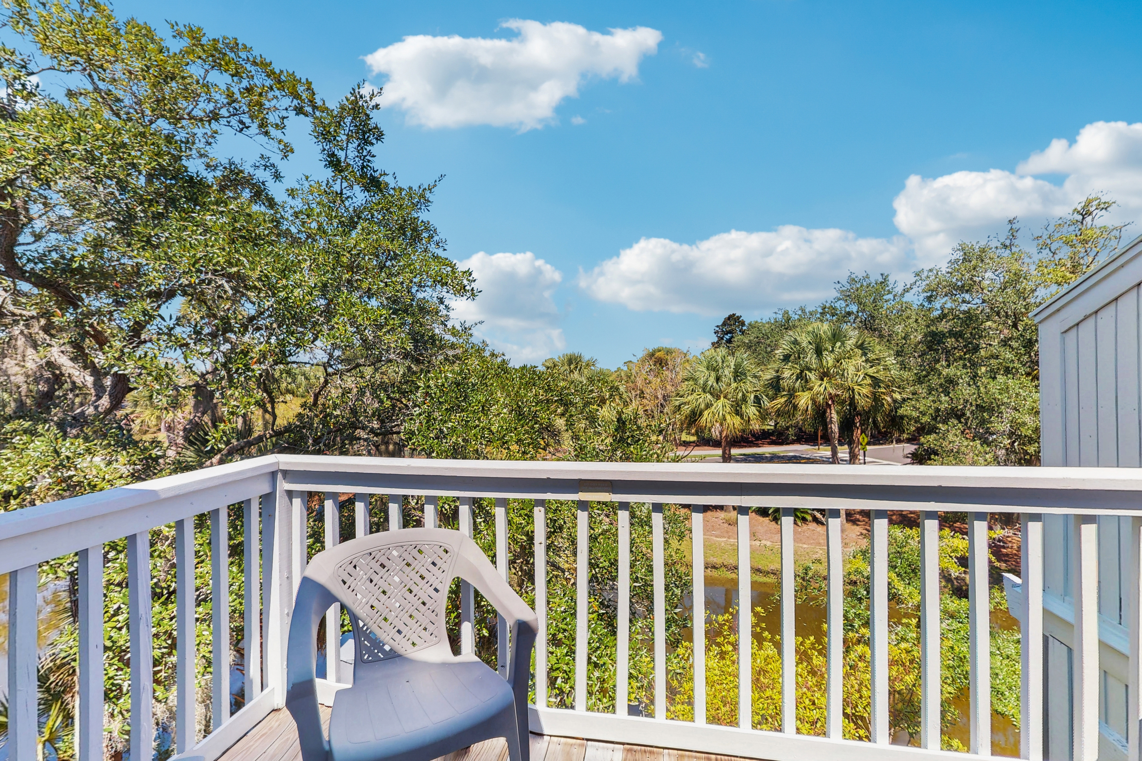 Quaint top floor lagoon view condo w/ community pool access - walk to the beach