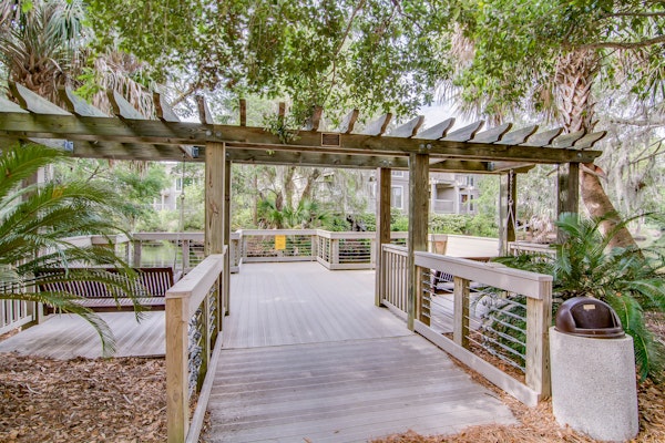 Quaint top floor lagoon view condo w/ community pool access - walk to the beach