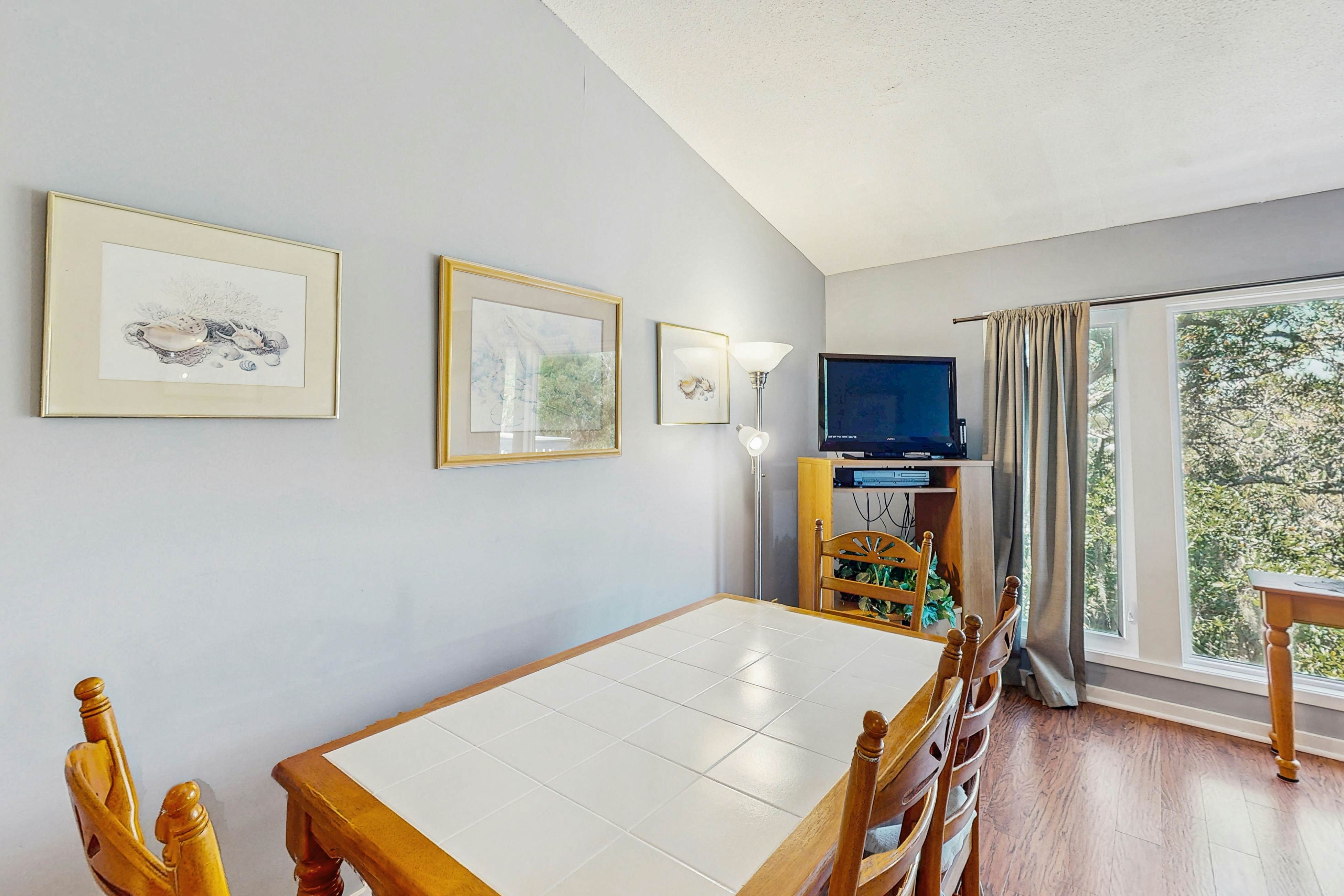 Quaint top floor lagoon view condo w/ community pool access - walk to the beach