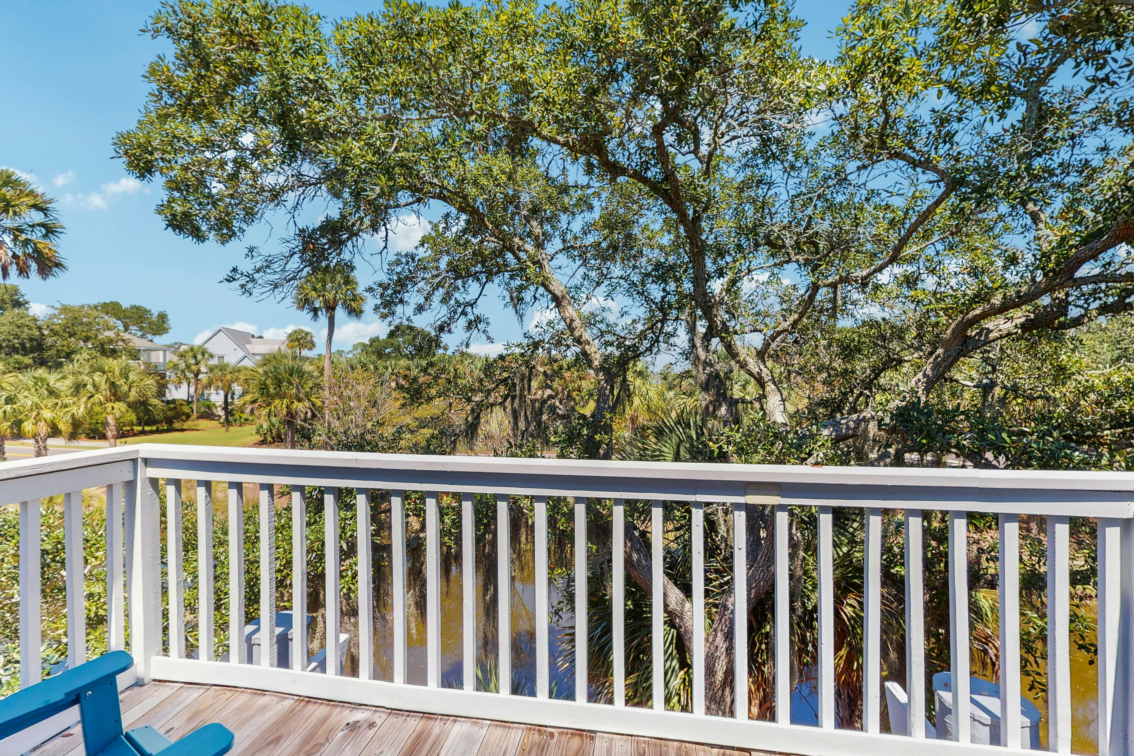 Quaint top floor lagoon view condo w/ community pool access - walk to the beach
