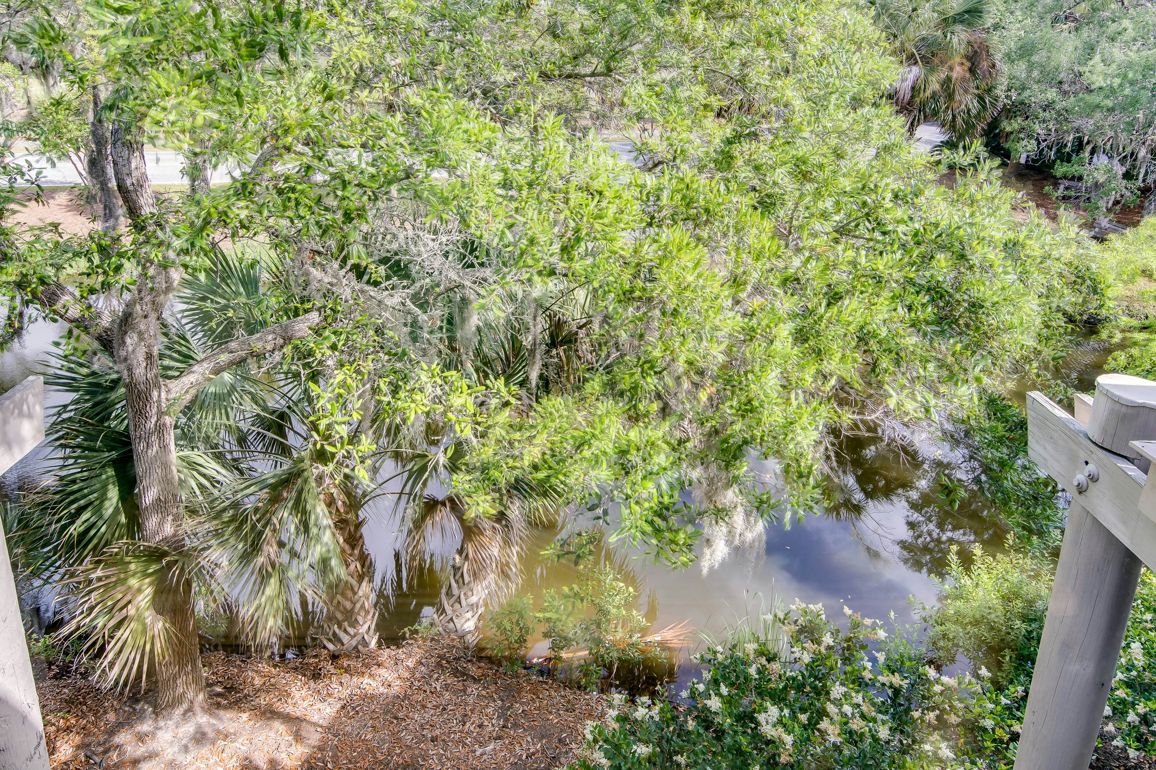 Quaint top floor lagoon view condo w/ community pool access - walk to the beach