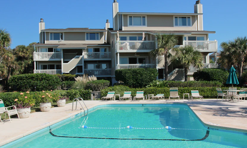Beautiful villa surrounded by lush landscaping - walk to beach, golf & pool