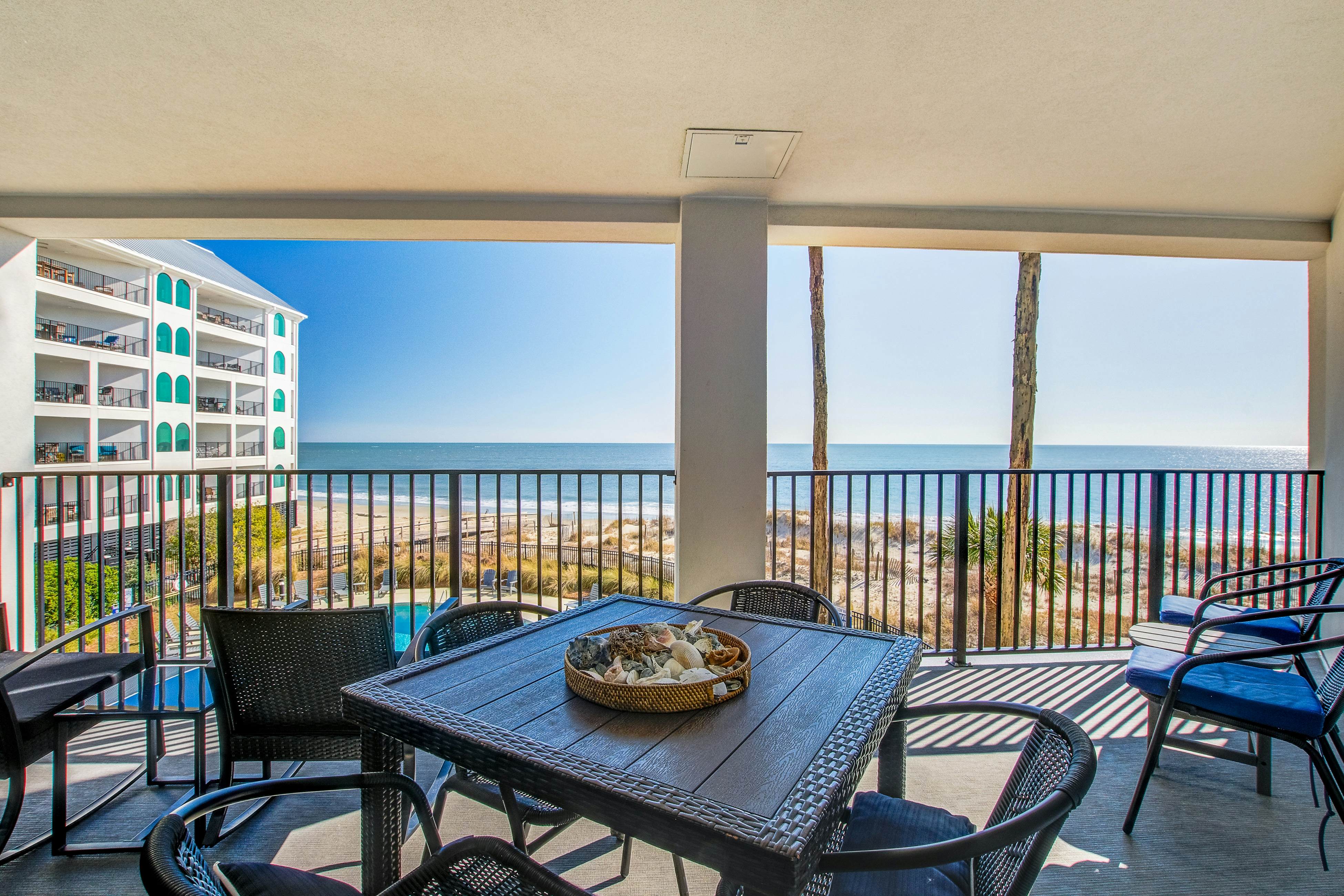 Bright and spacious condo with beach & ocean views, pool, basketball & balcony