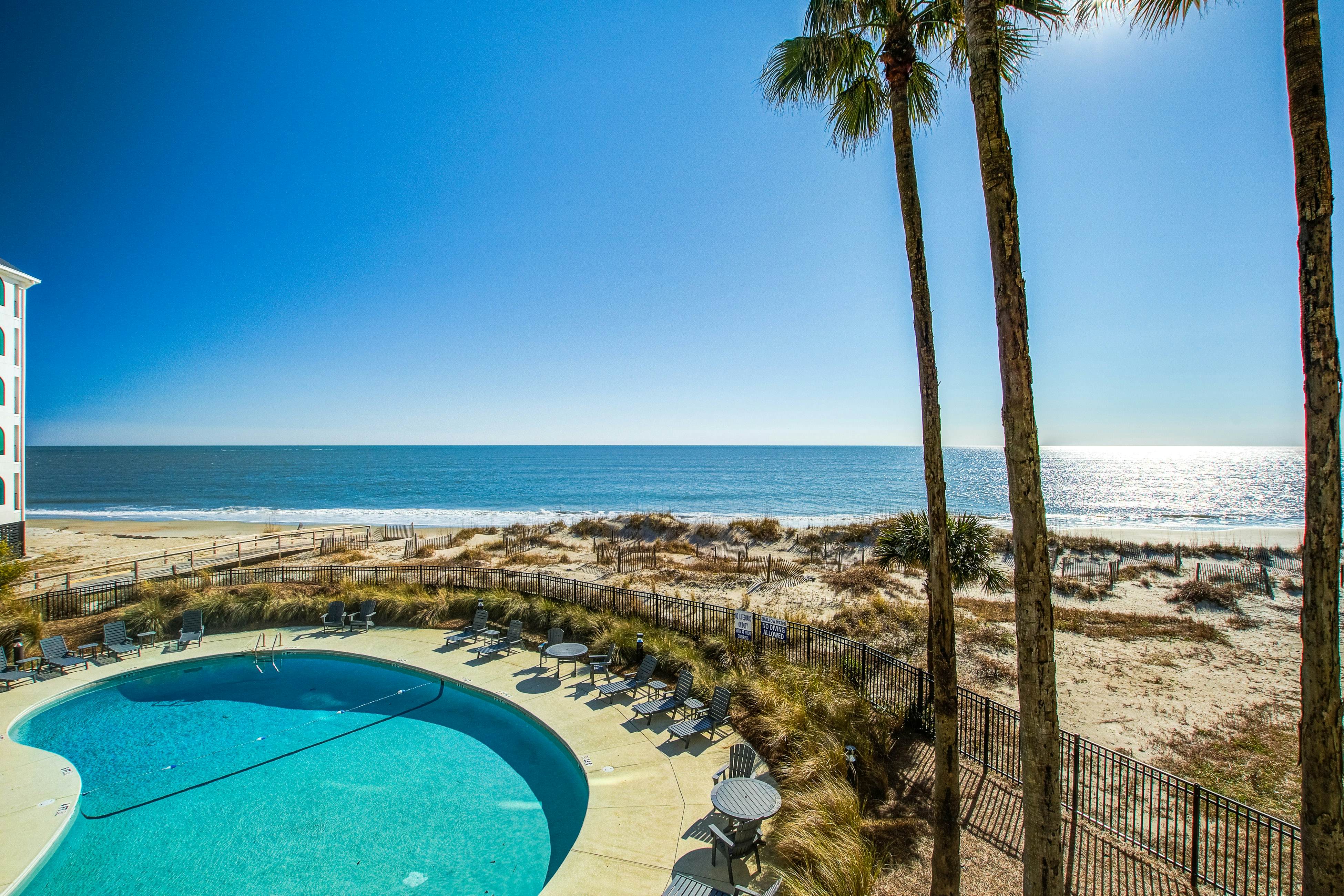 Bright and spacious condo with beach & ocean views, pool, basketball & balcony