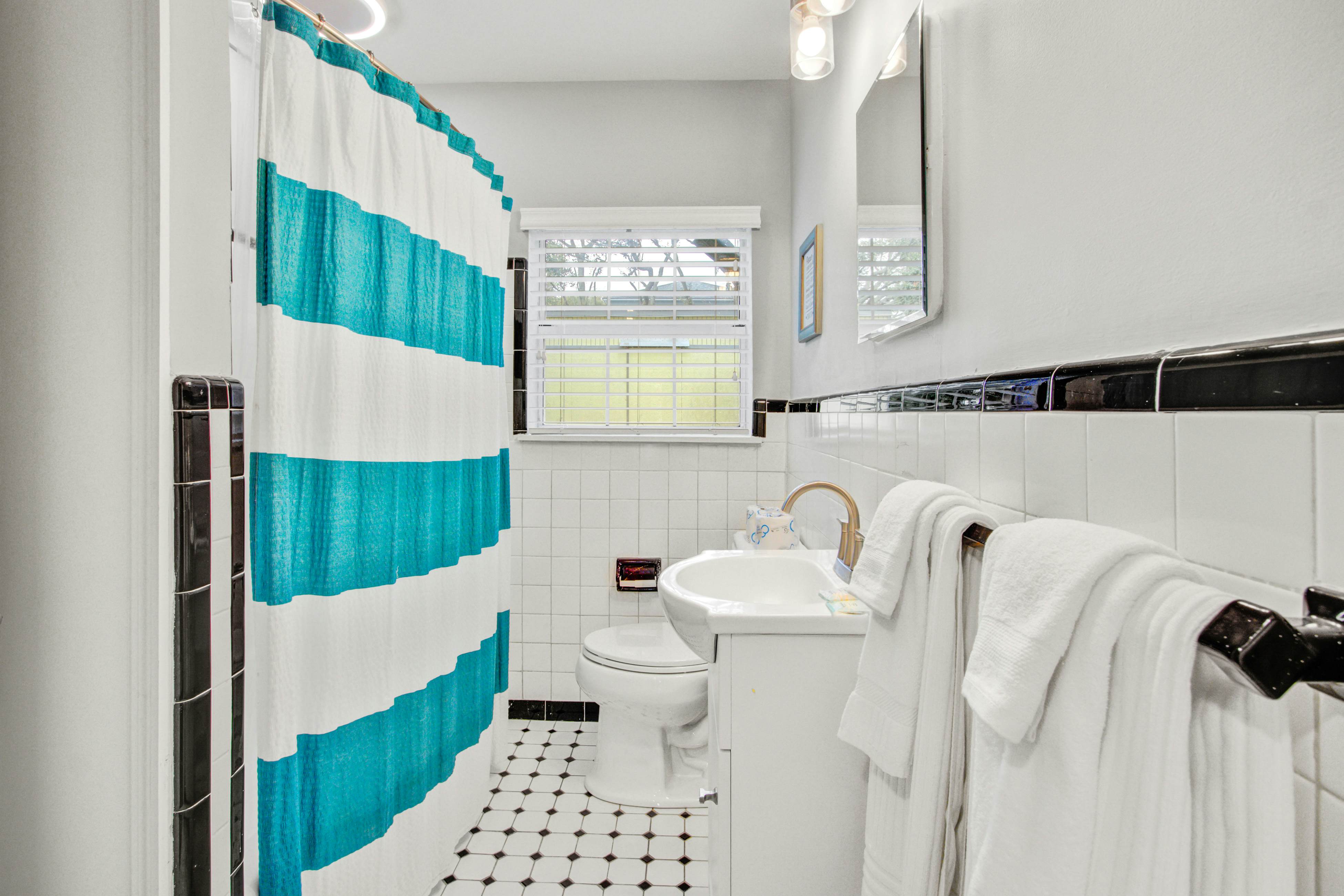 Dog-friendly, ocean-view getaway with grill, deck, beach access & basketball