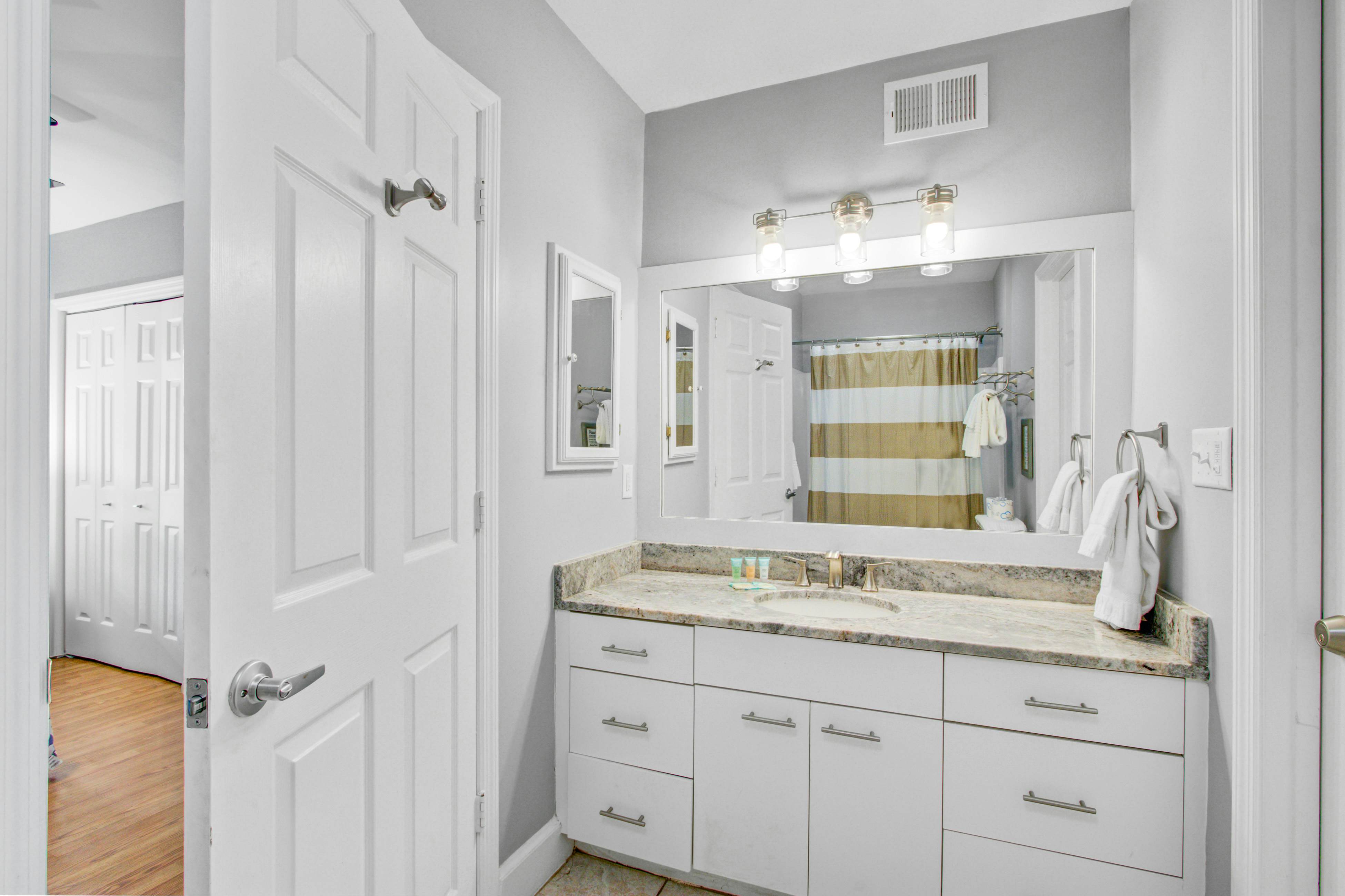 Dog-friendly, ocean-view getaway with grill, deck, beach access & basketball