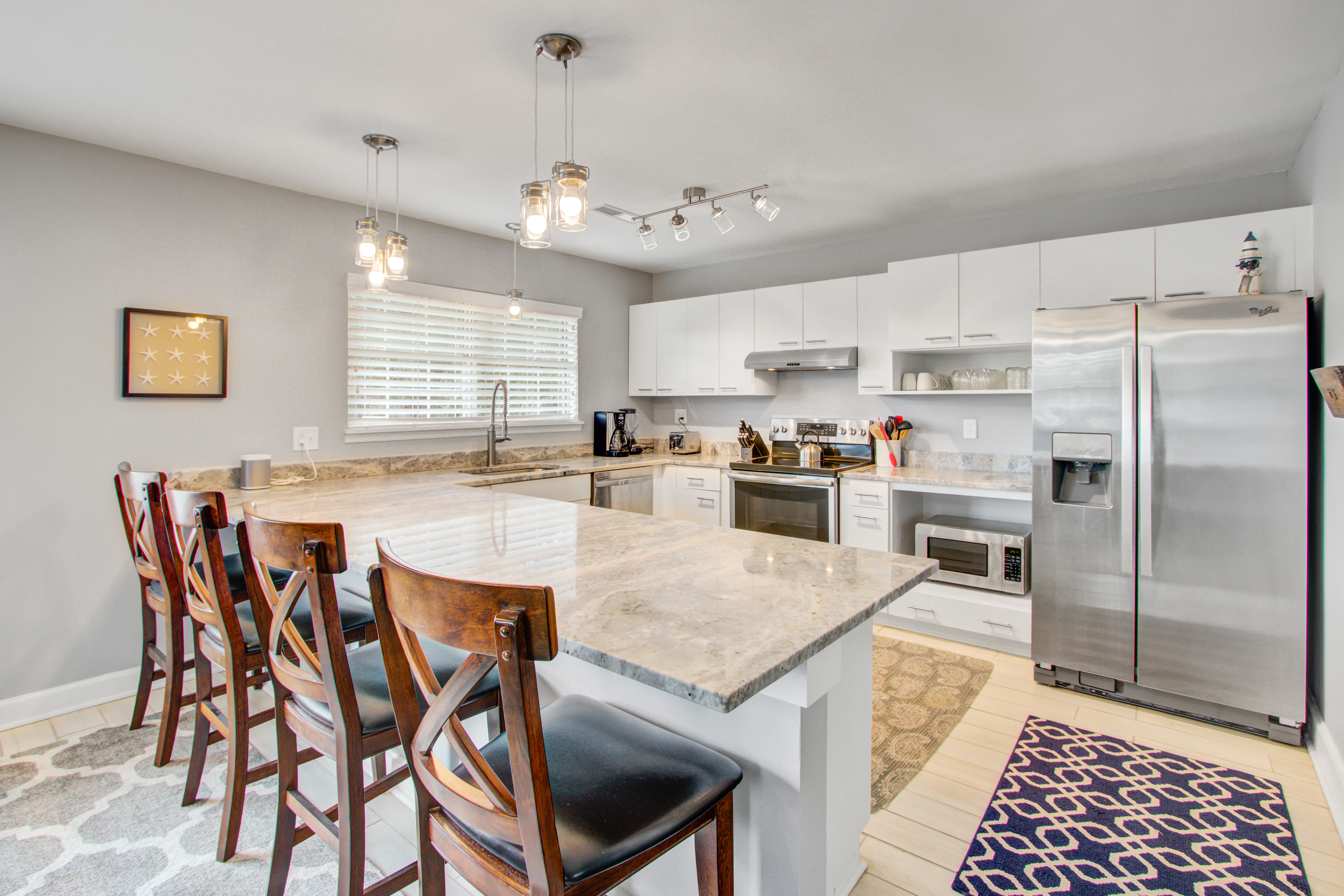 Convenient dog-friendly retreat steps from the beach with grill & screened porch