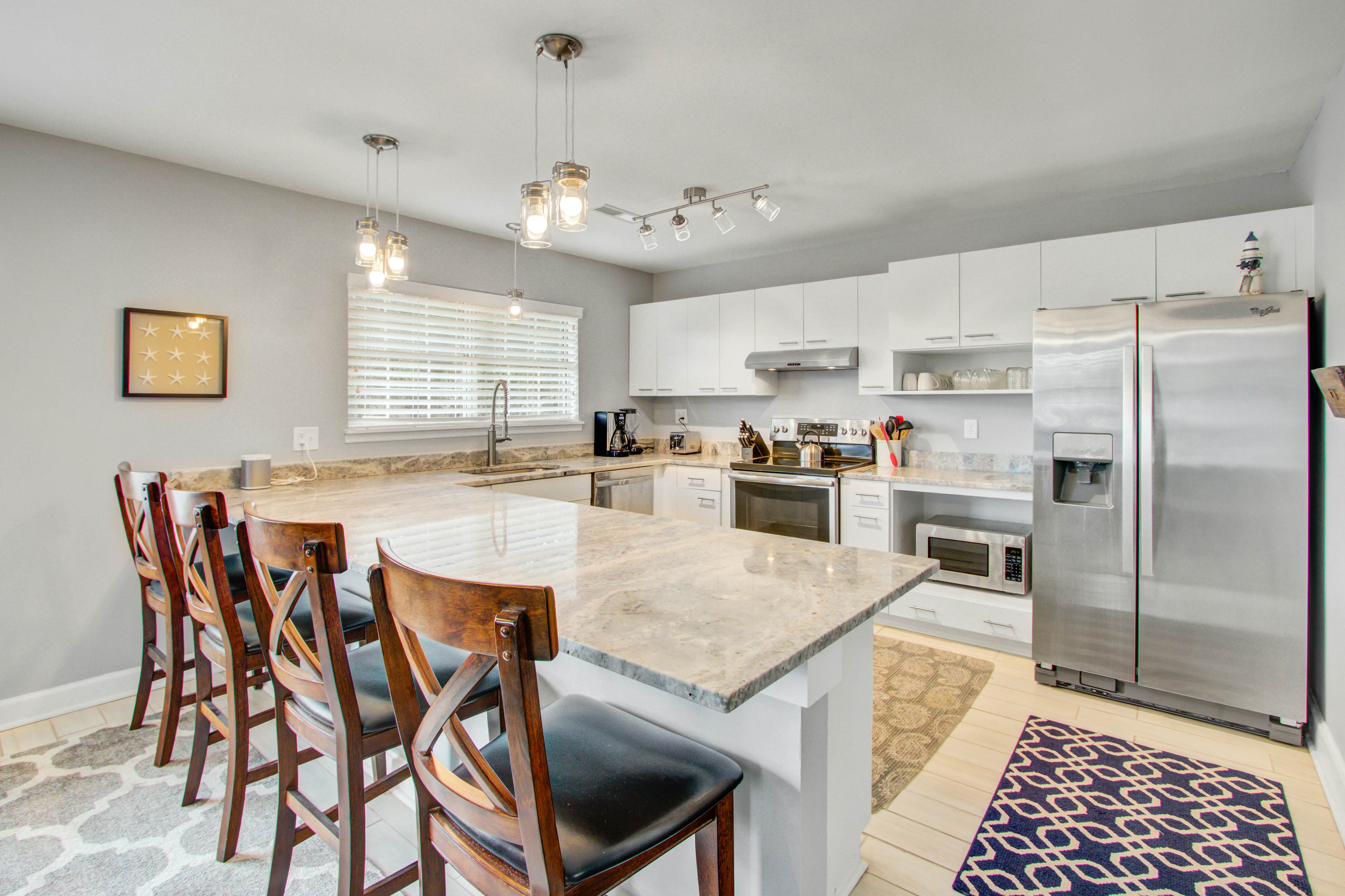 Convenient dog-friendly retreat steps from the beach with grill & screened porch