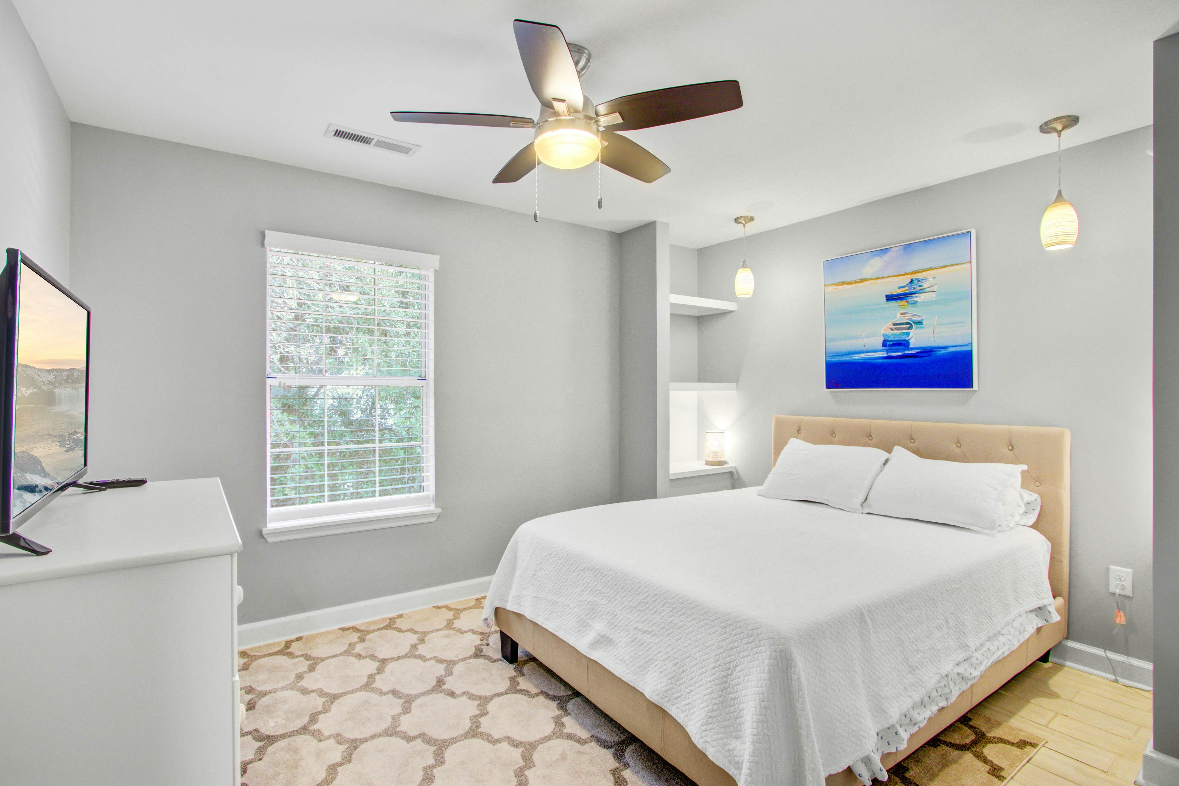 Convenient dog-friendly retreat steps from the beach with grill & screened porch