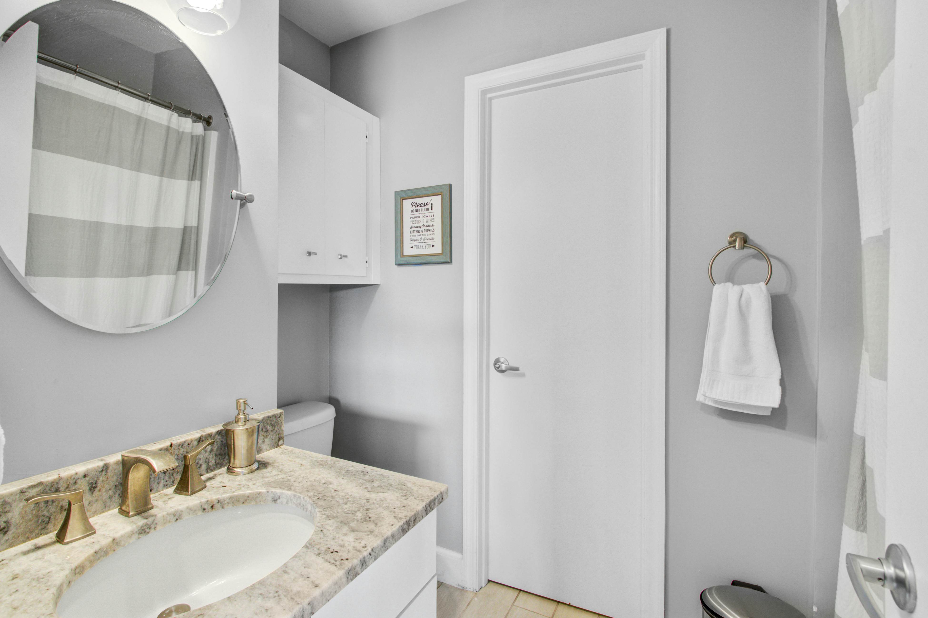 Convenient dog-friendly retreat steps from the beach with grill & screened porch