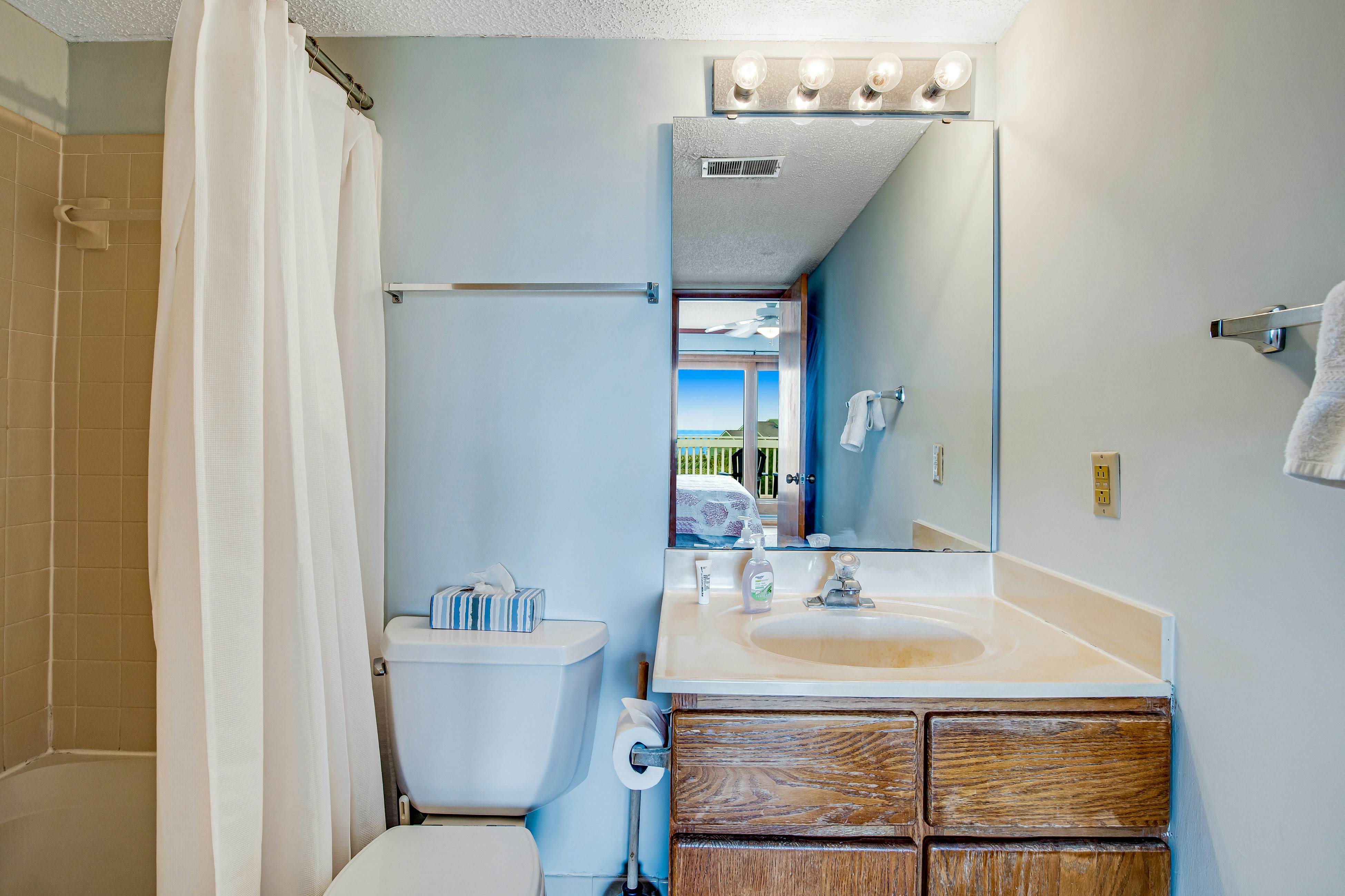 Three-story ocean-view villa with pool, balcony, charcoal grill, & central AC