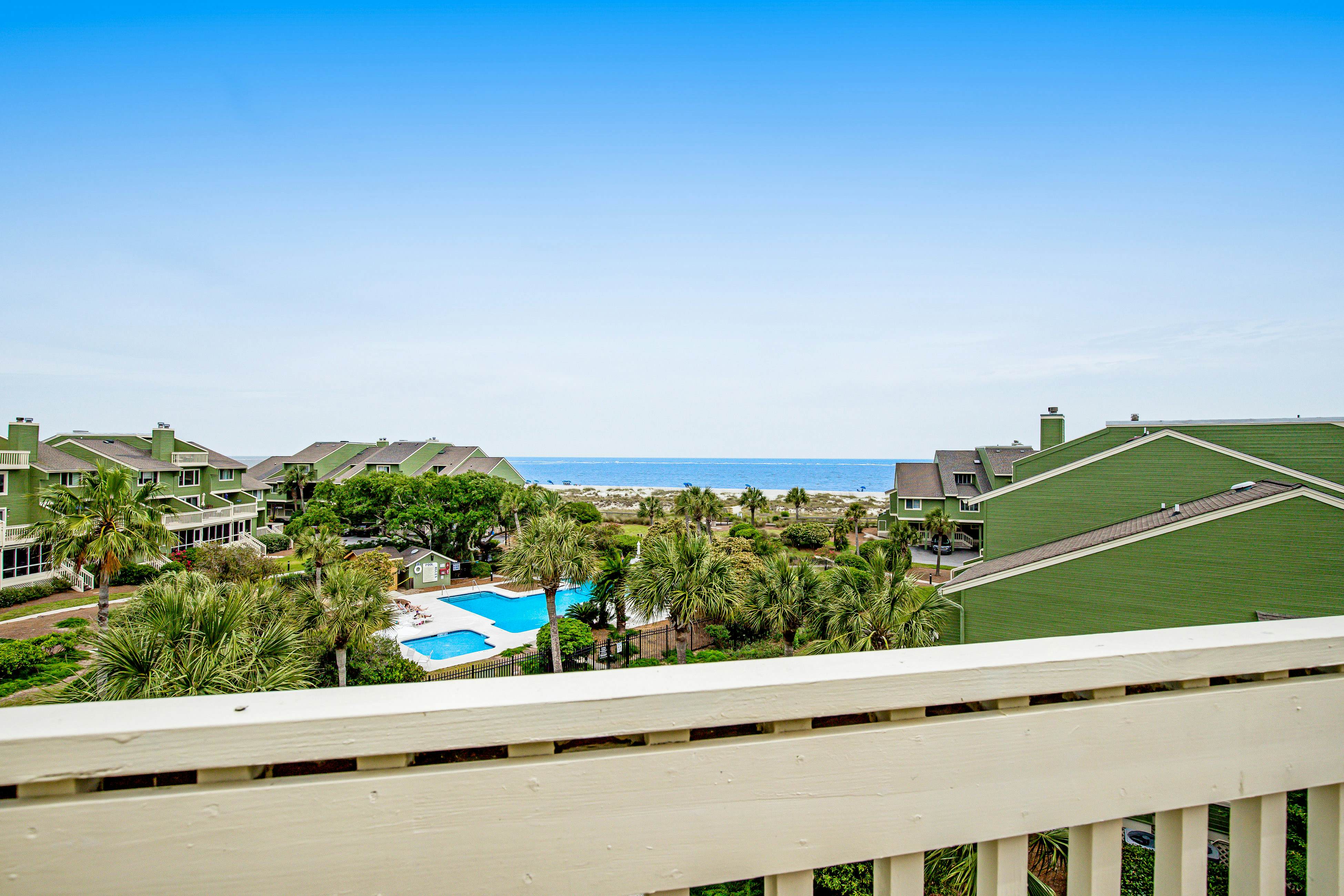 Three-story ocean-view villa with pool, balcony, charcoal grill, & central AC
