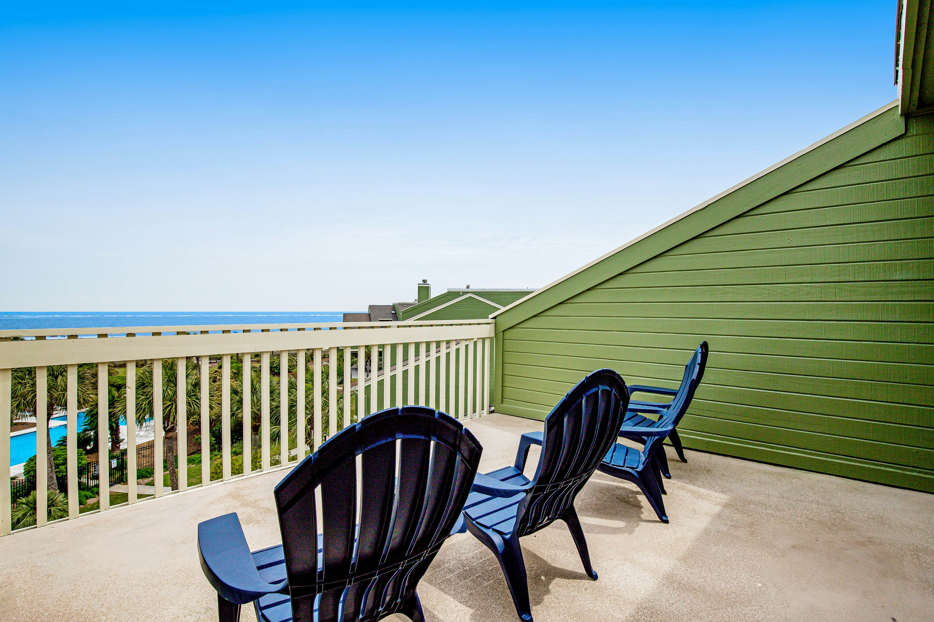 Three-story ocean-view villa with pool, balcony, charcoal grill, & central AC