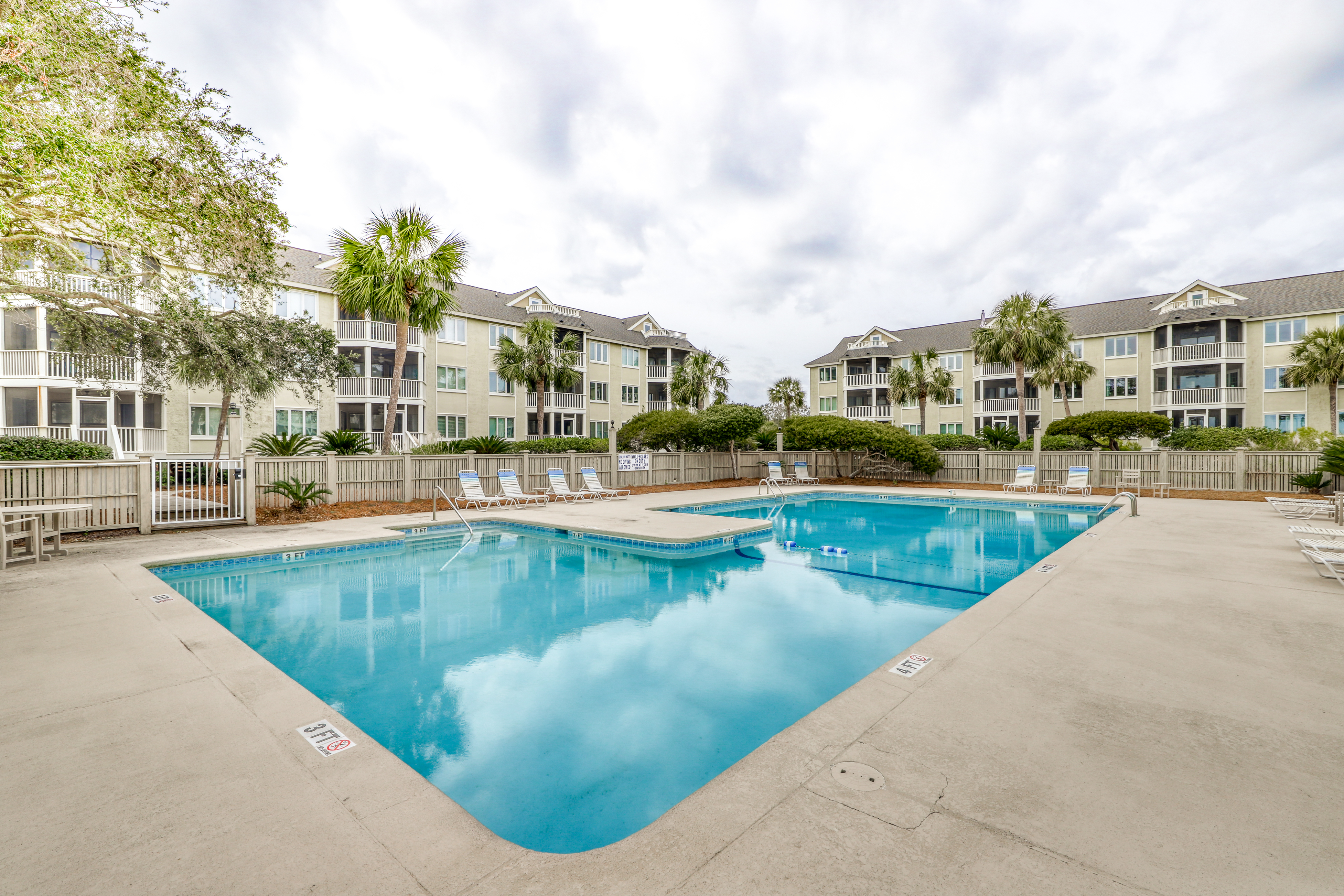 Lovely top floor villa in Wild Dunes with partial ocean views, pool, & W/D