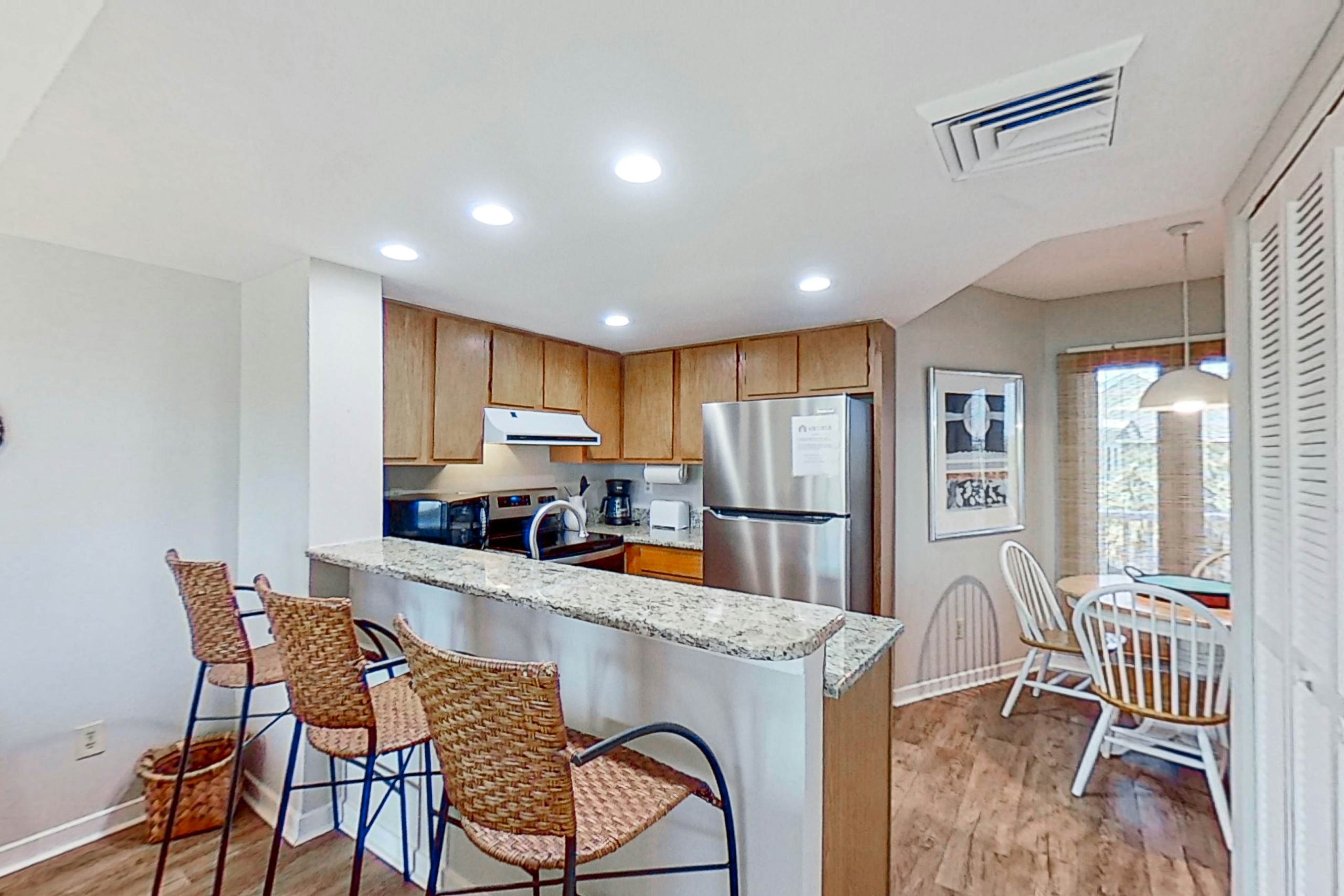 Lovely top floor villa in Wild Dunes with partial ocean views, pool, & W/D