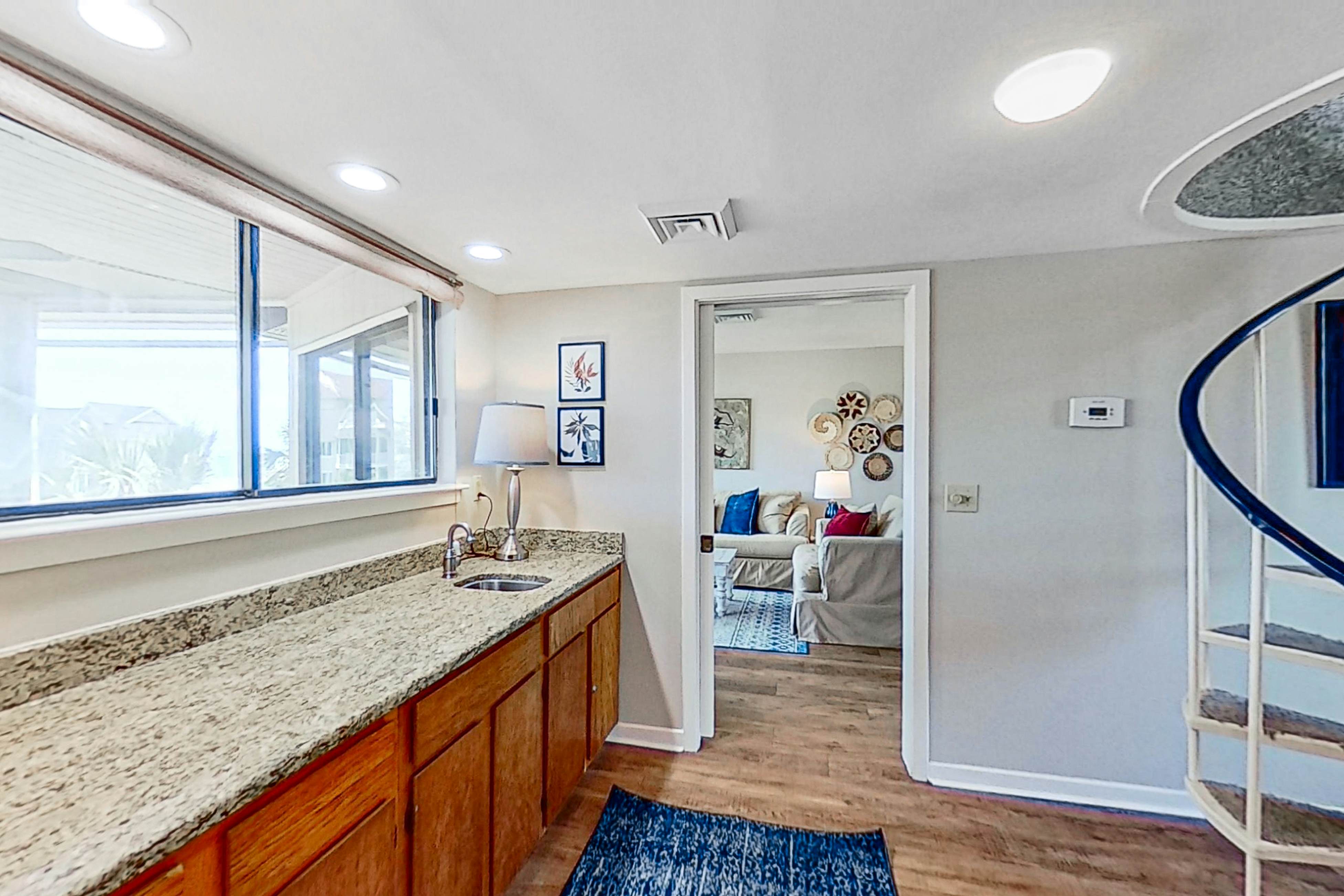 Lovely top floor villa in Wild Dunes with partial ocean views, pool, & W/D