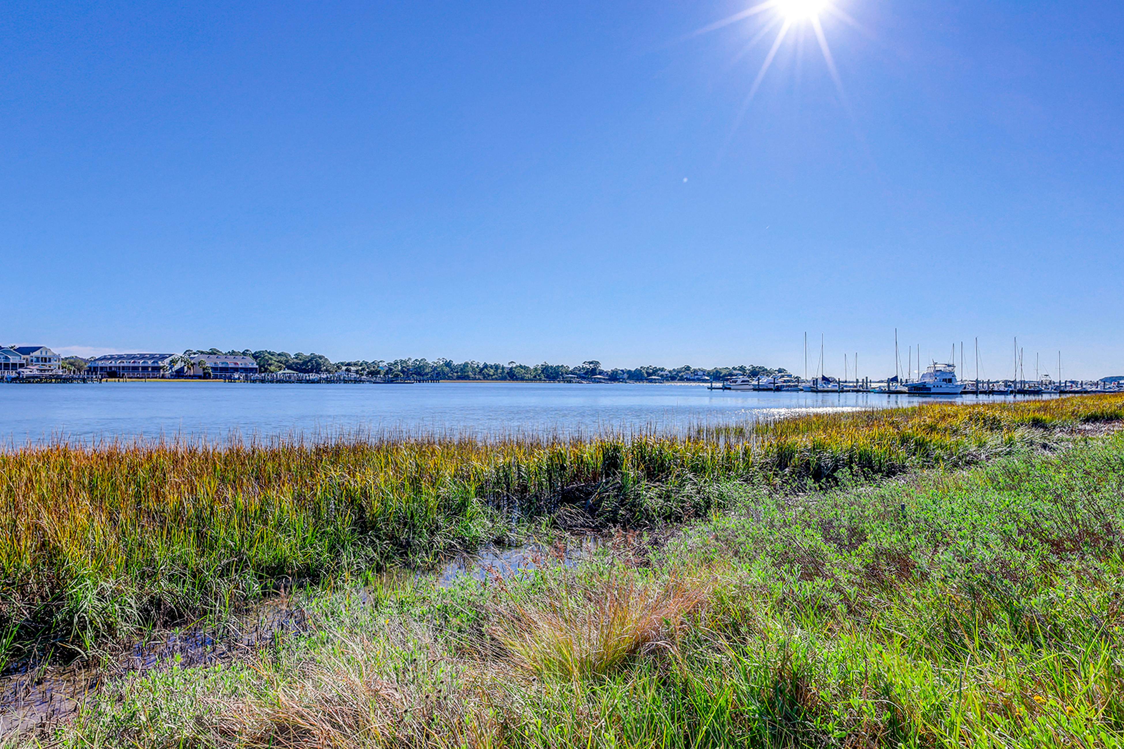 Riverfront condo with pool, 2 tennis courts, & screened porch - near beach