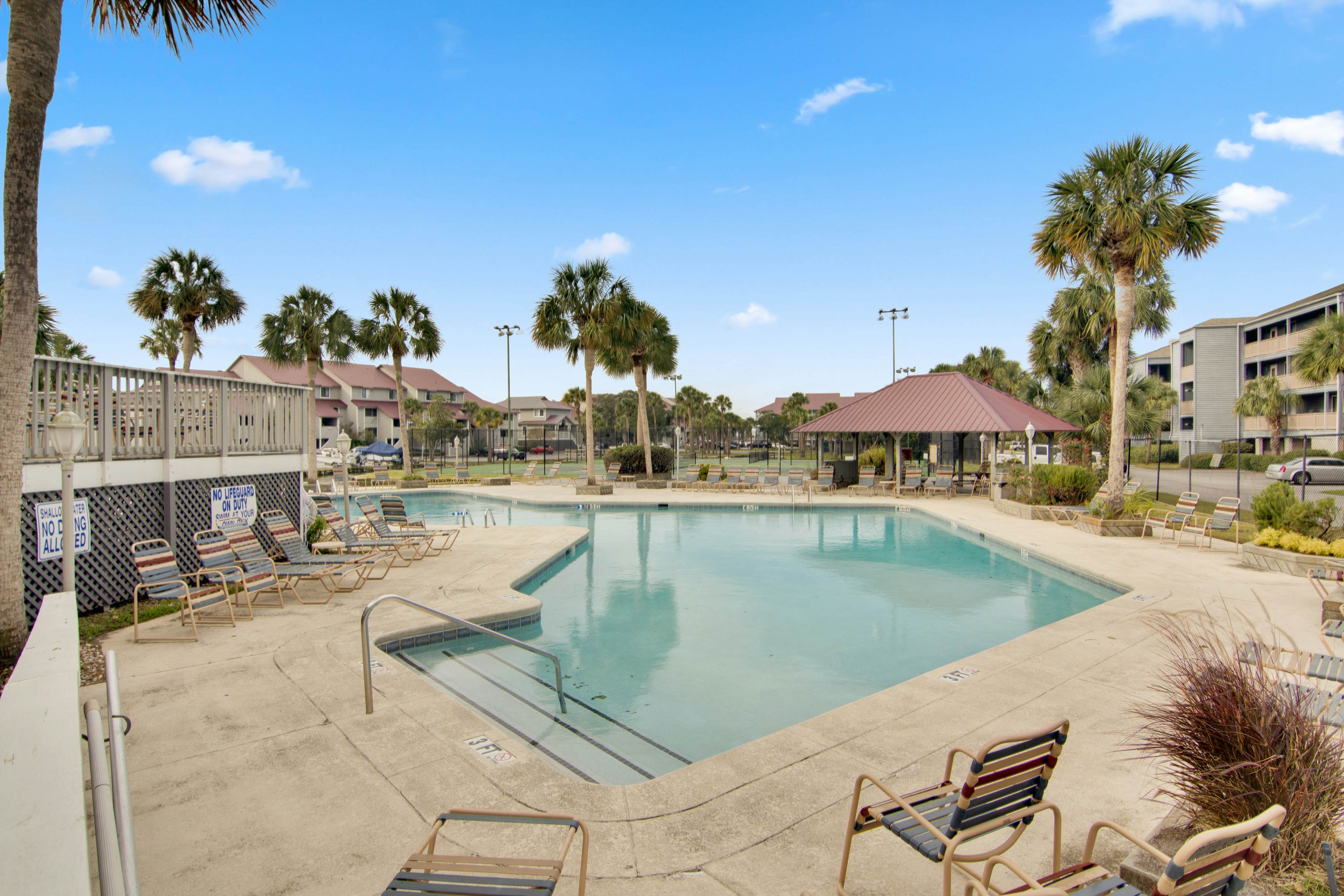 Riverfront condo with pool, 2 tennis courts, & screened porch - near beach