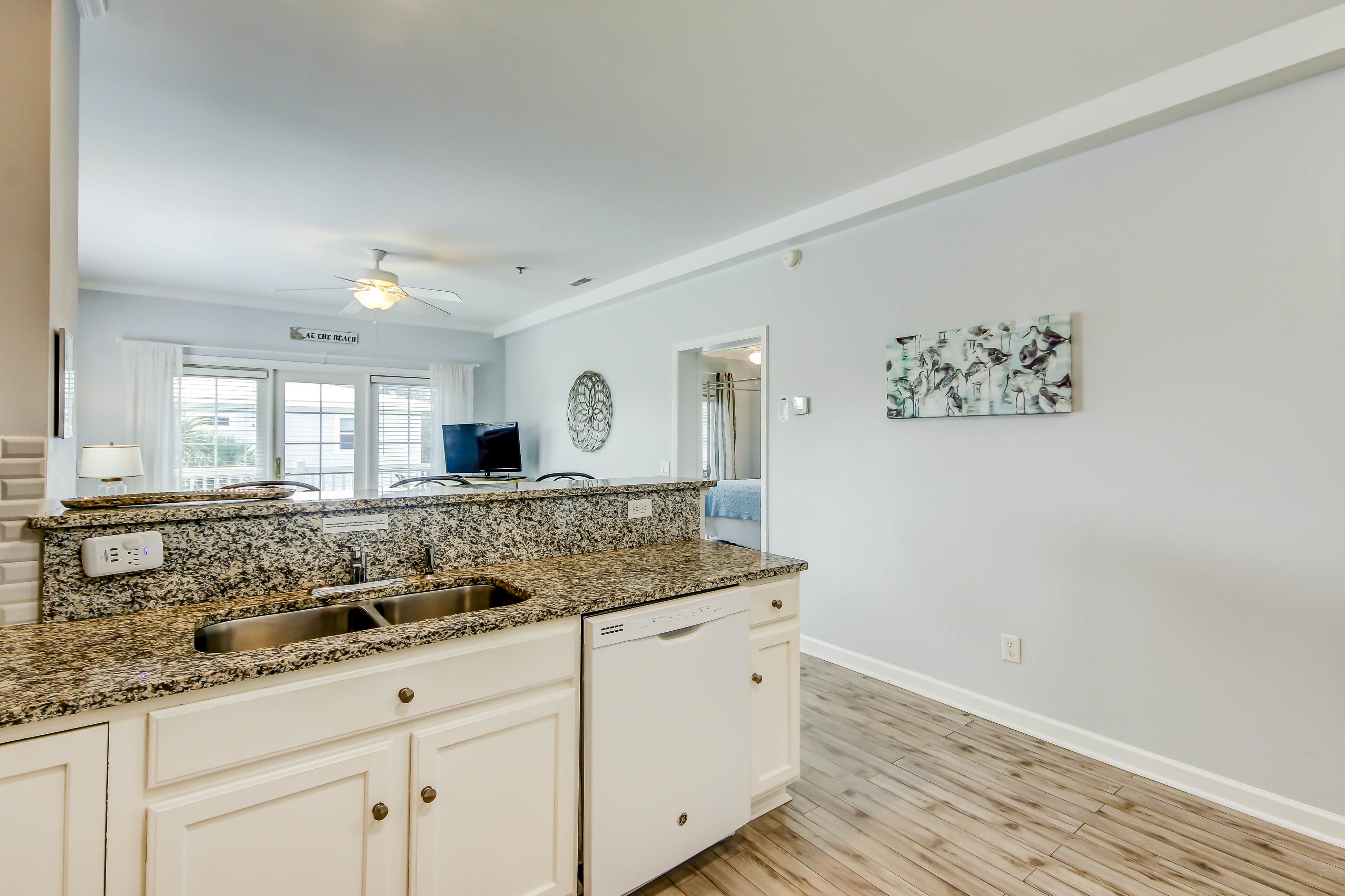 Fantastic condo with water-view, pool, balcony, central AC, & washer/dryer