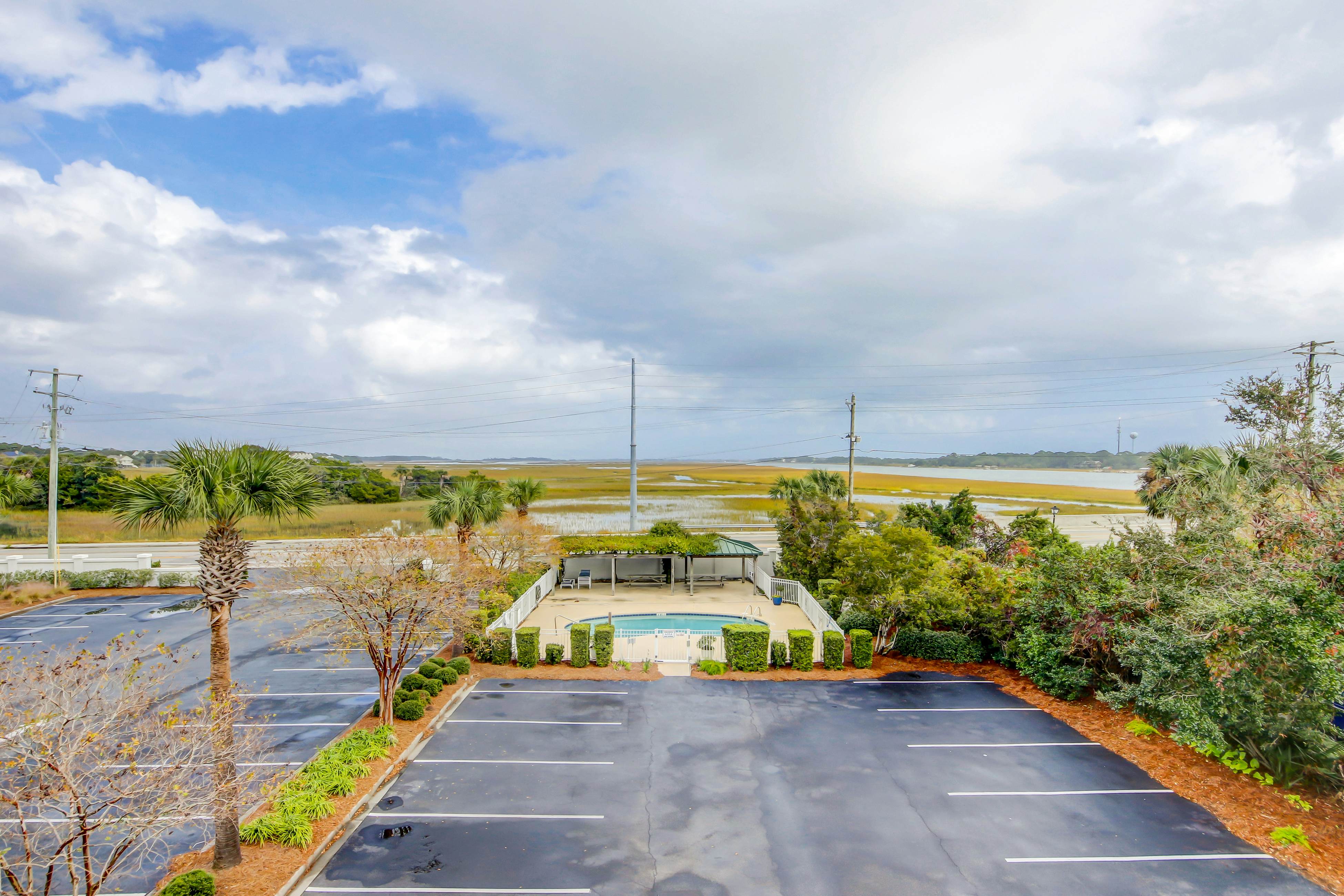 Fantastic condo with water-view, pool, balcony, central AC, & washer/dryer