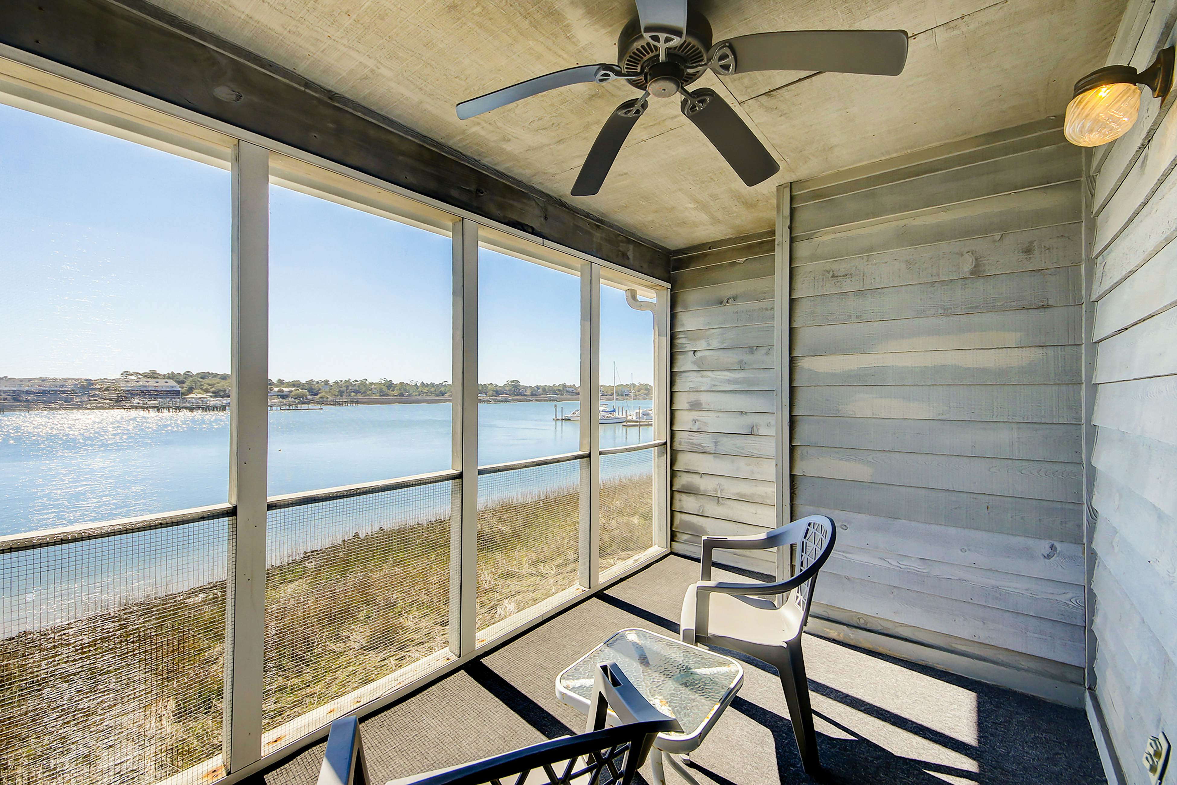 2-story riverfront condo with 2 balconies, outdoor pool, grills, river views, AC