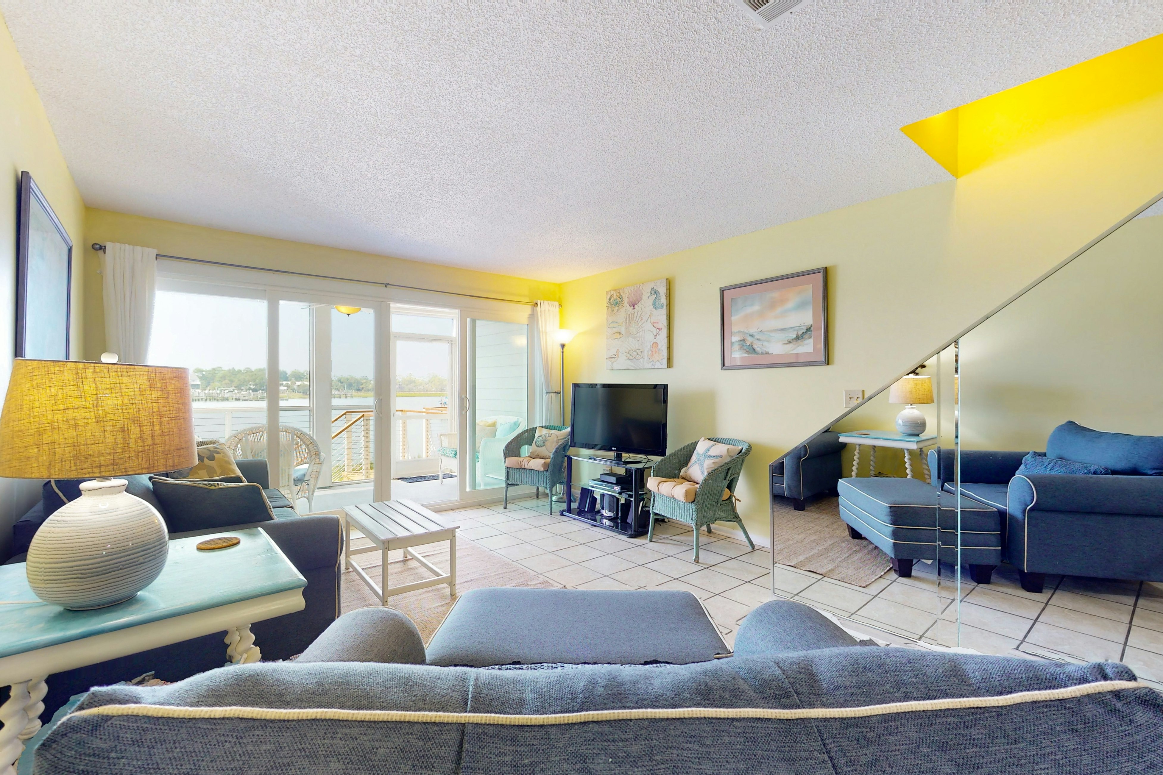 Waterfront condo with covered deck, amazing view, pool, & tennis courts