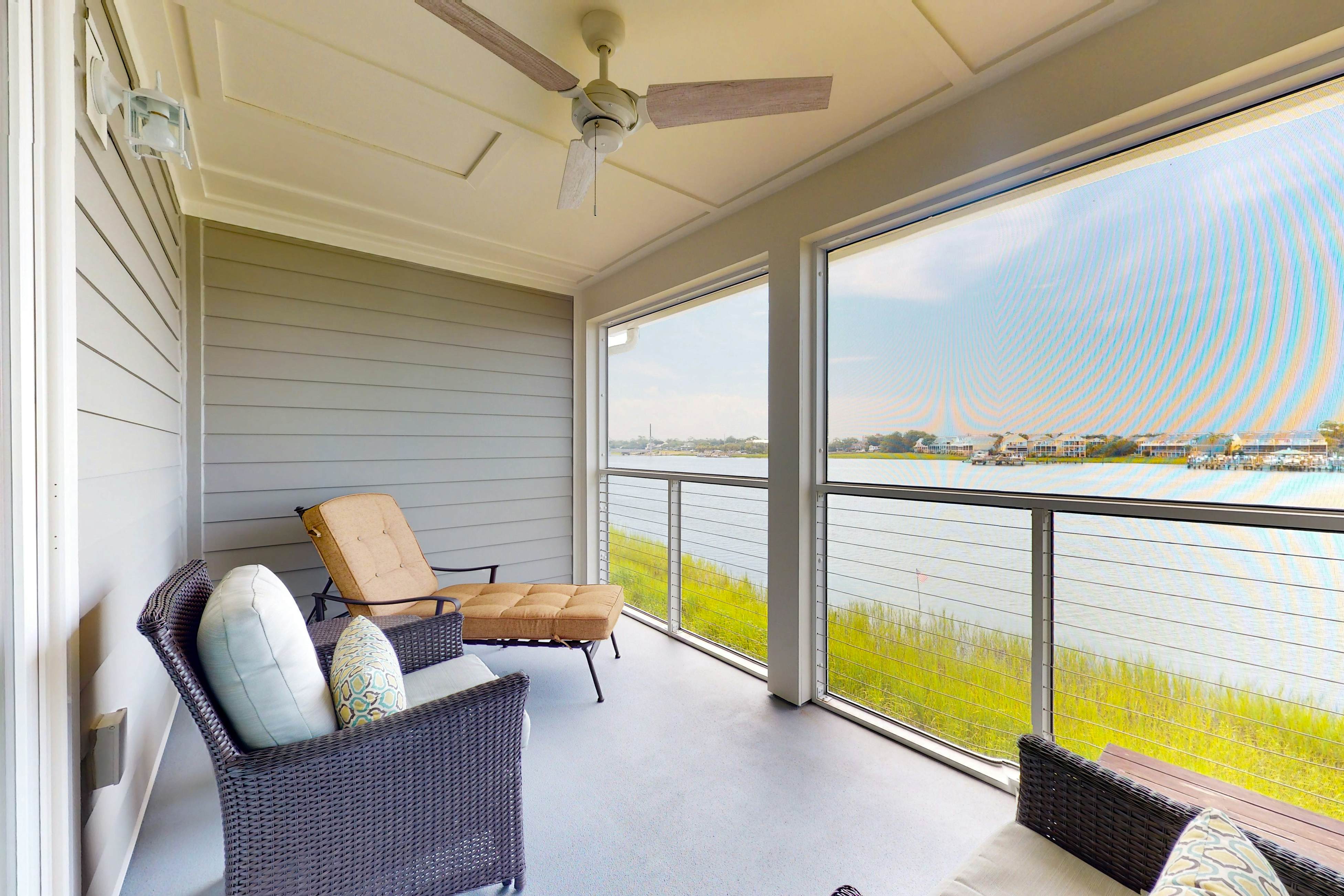 Waterfront condo with covered deck, amazing view, pool, & tennis courts