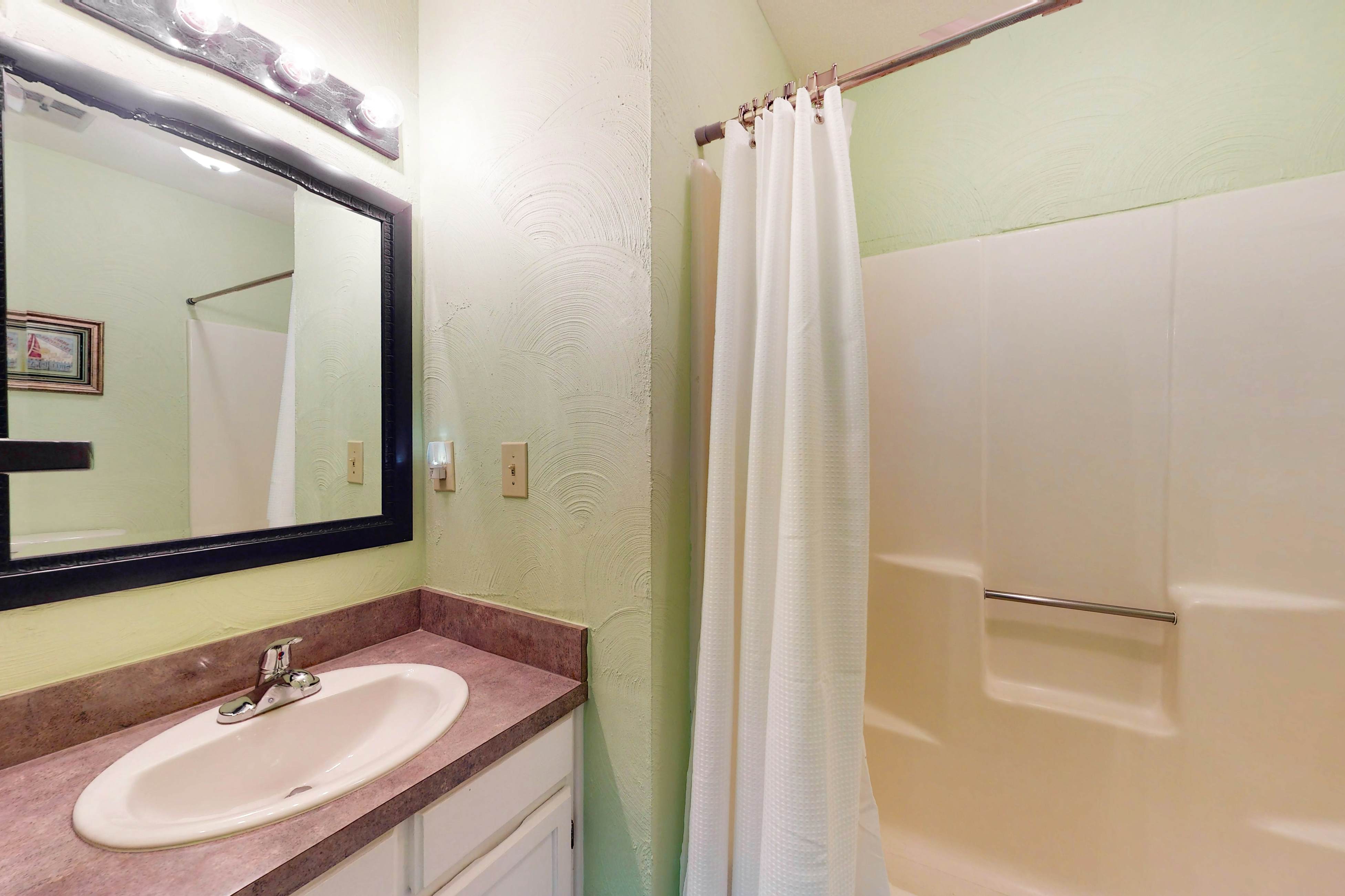 Waterfront condo with covered deck, amazing view, pool, & tennis courts