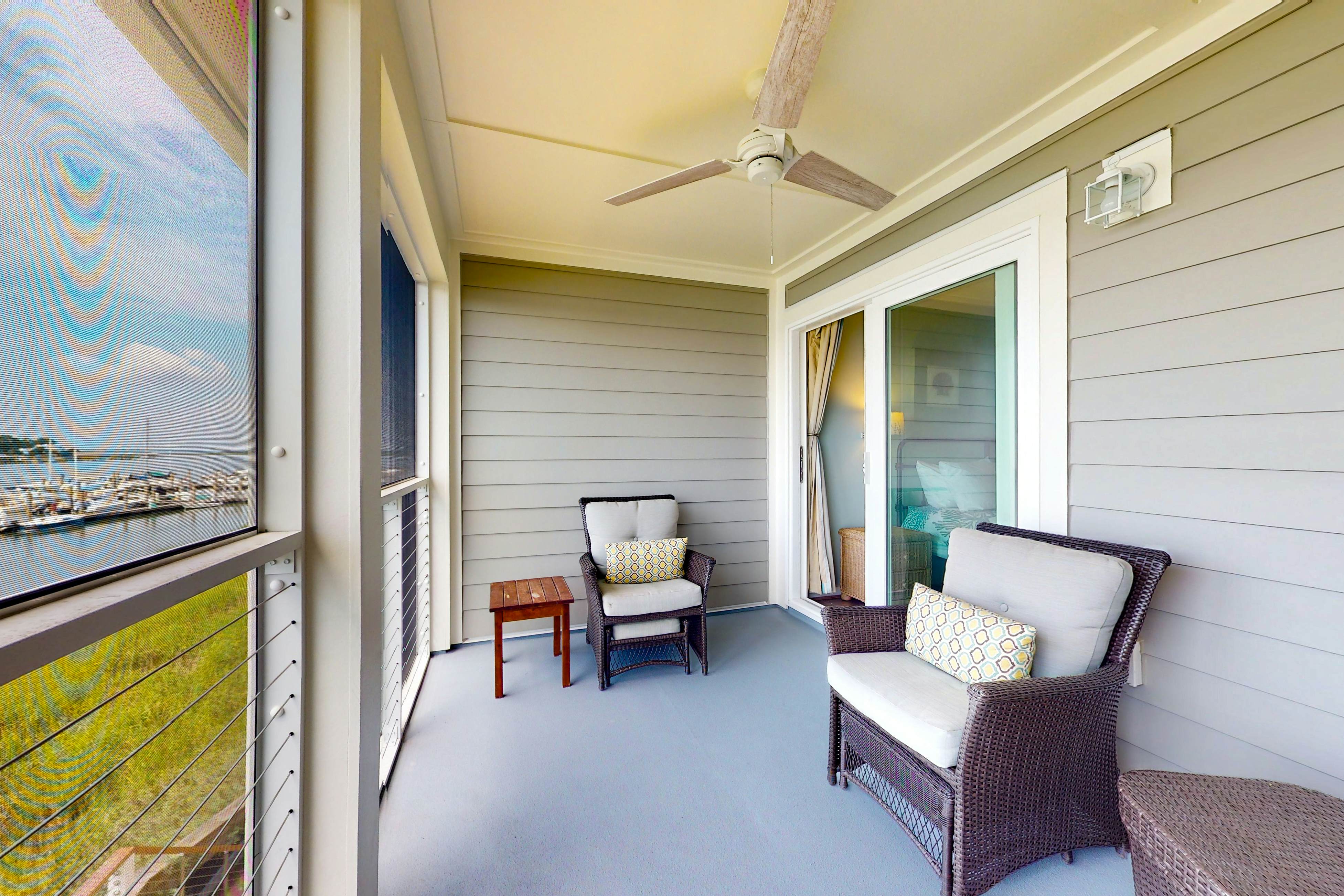 Waterfront condo with covered deck, amazing view, pool, & tennis courts