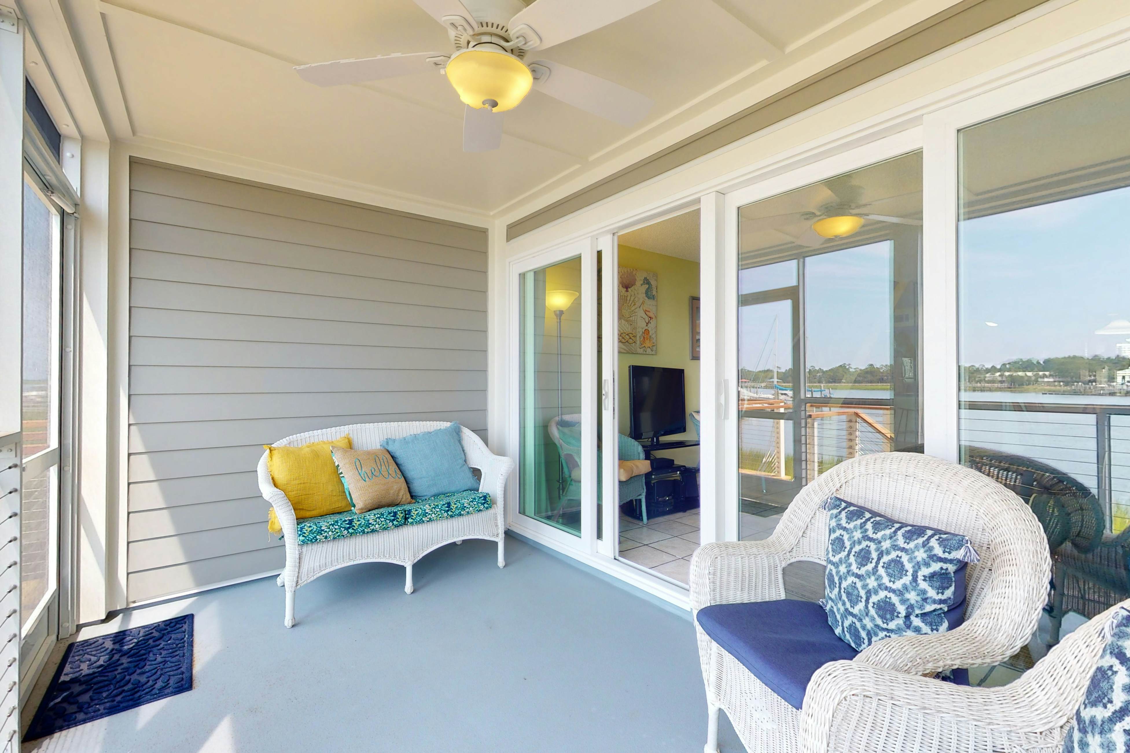 Waterfront condo with covered deck, amazing view, pool, & tennis courts