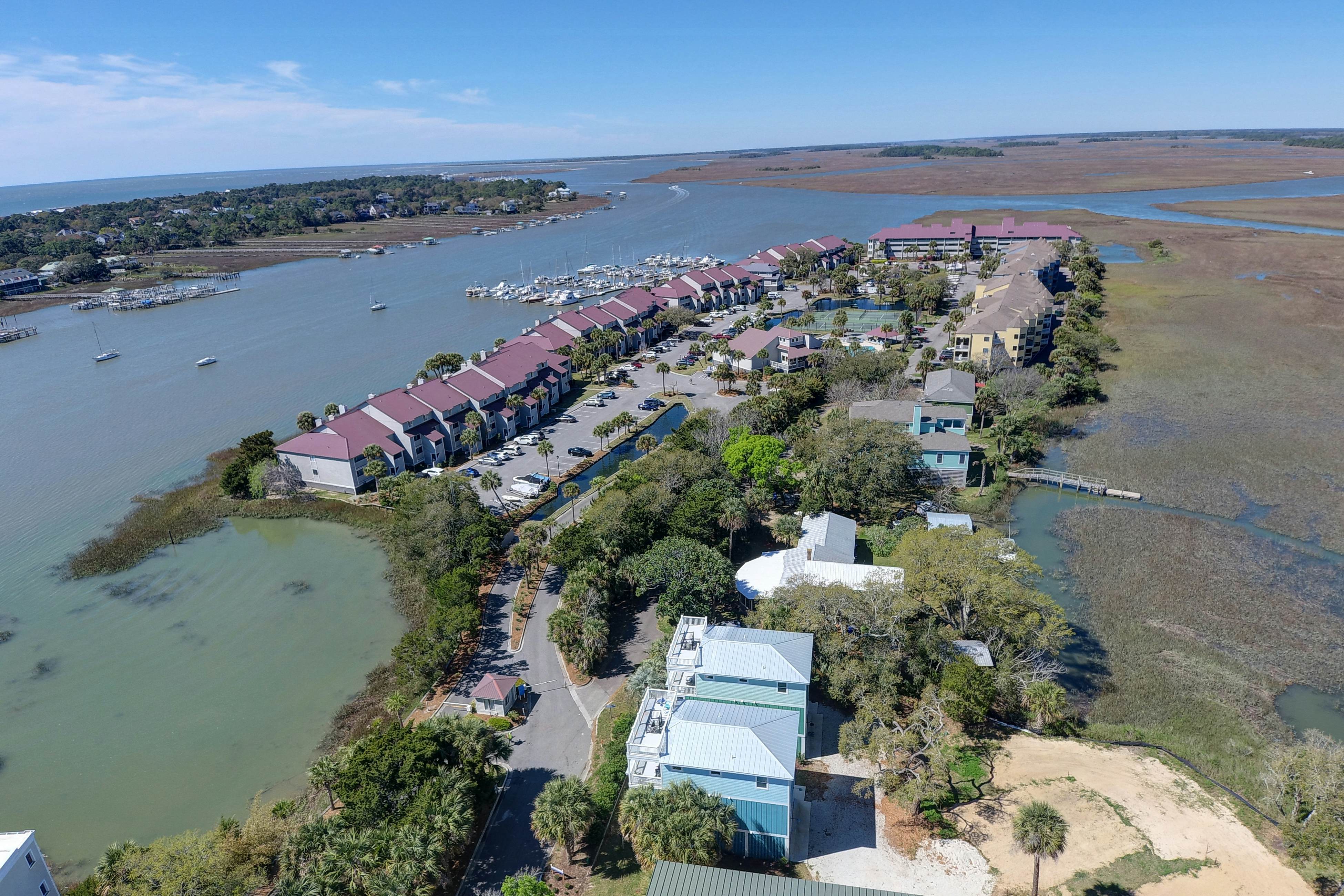 Waterfront condo with covered deck, amazing view, pool, & tennis courts
