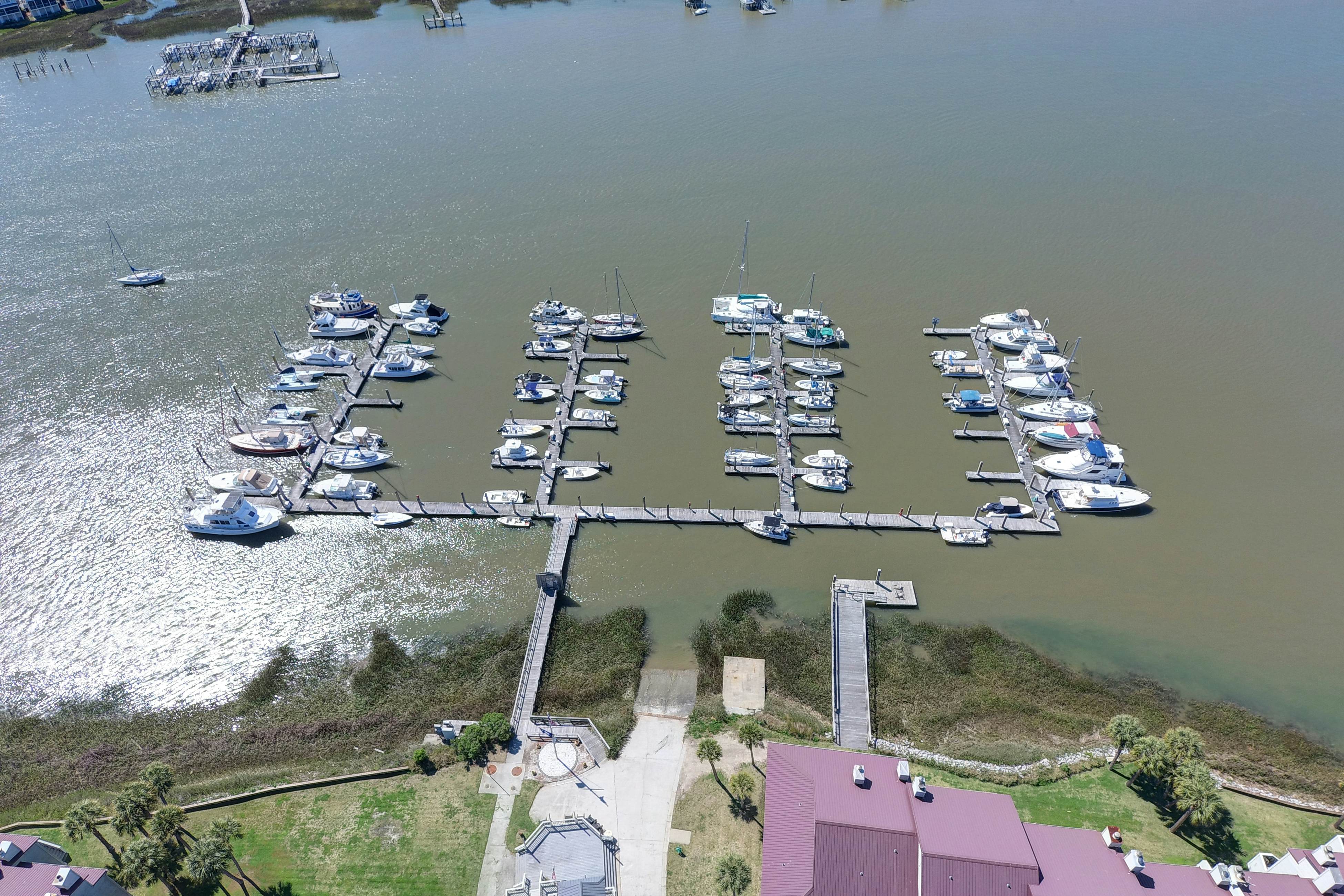 Waterfront condo with covered deck, amazing view, pool, & tennis courts