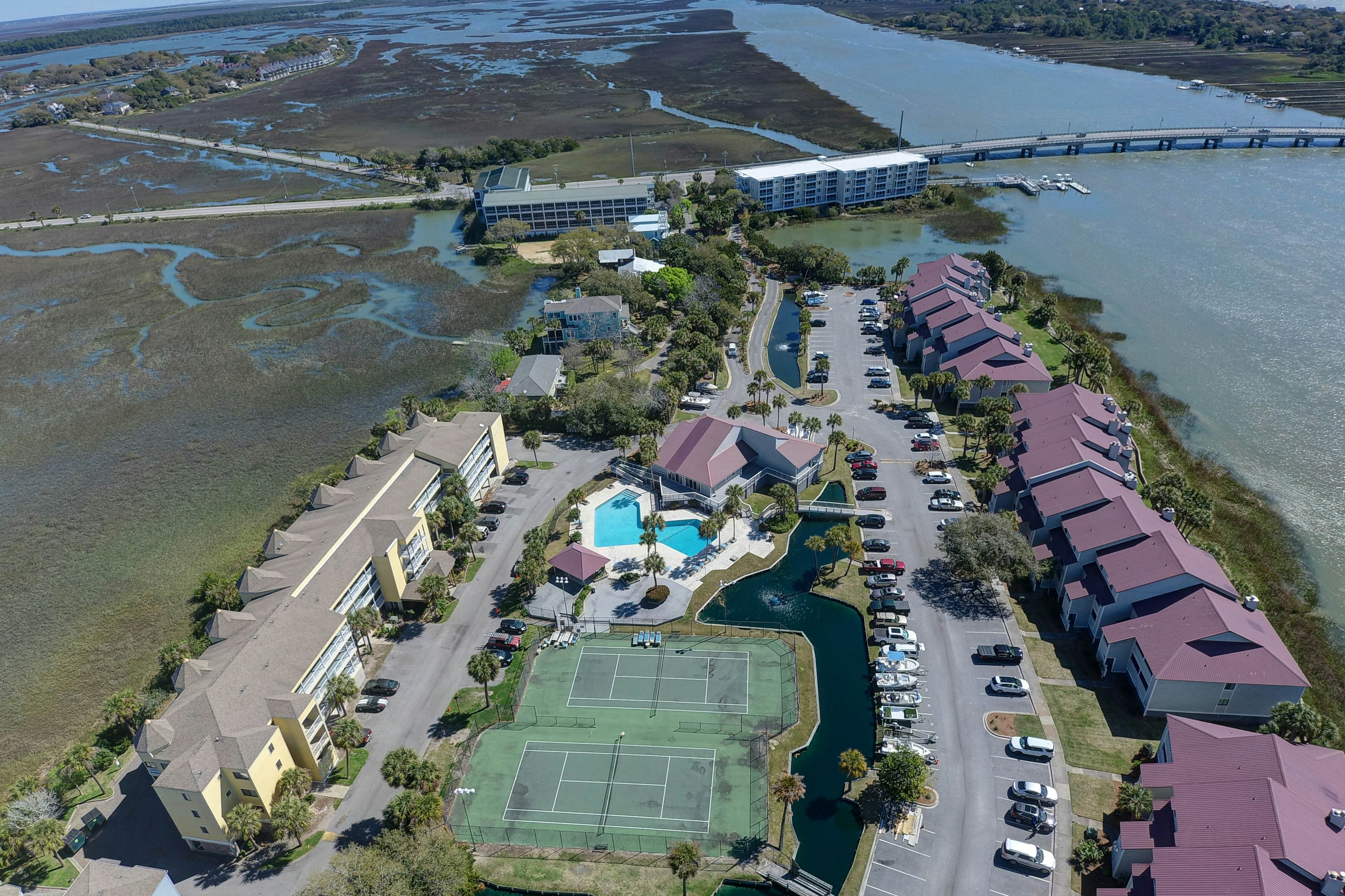 Waterfront condo with covered deck, amazing view, pool, & tennis courts