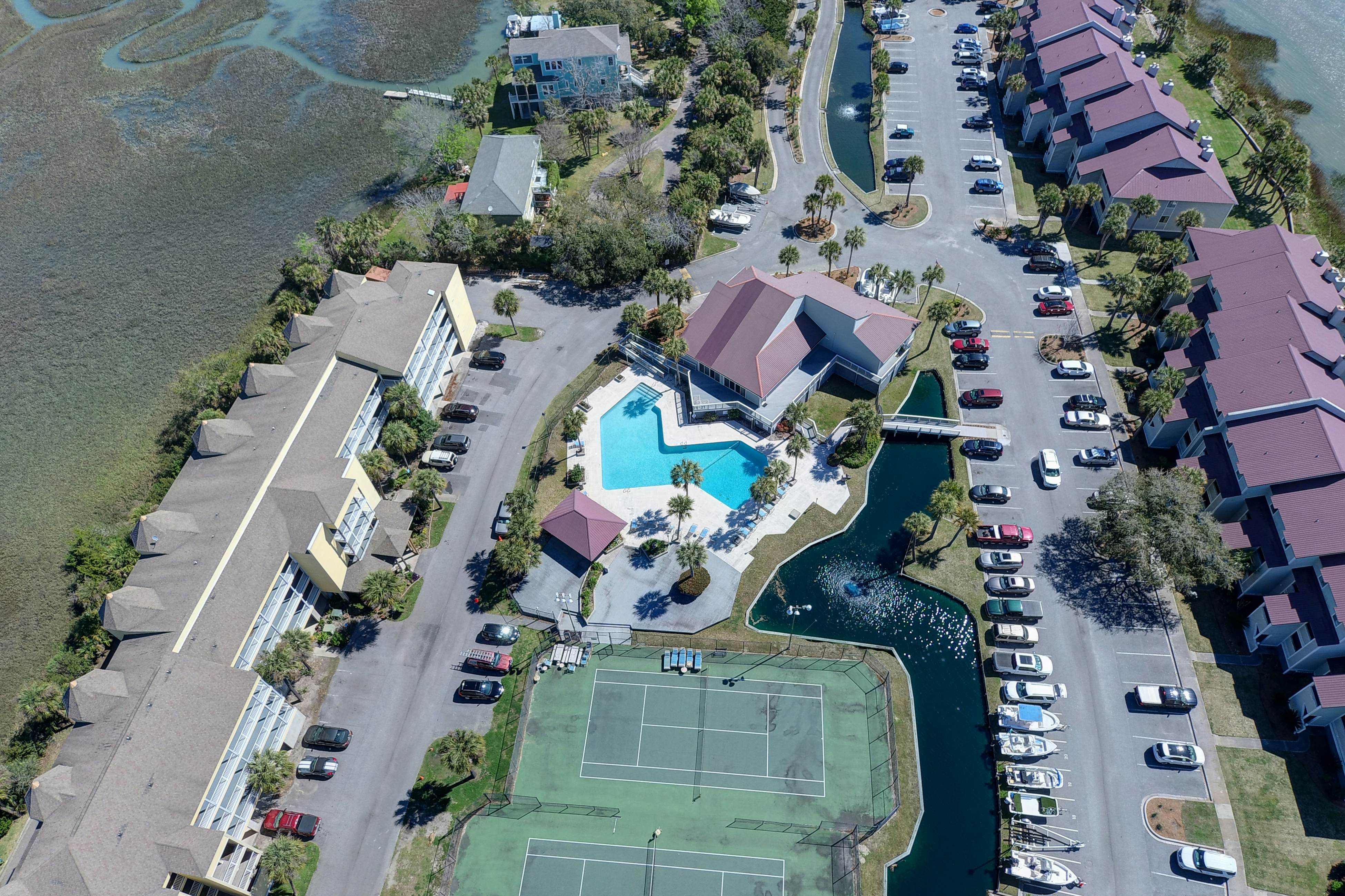 Waterfront condo with covered deck, amazing view, pool, & tennis courts