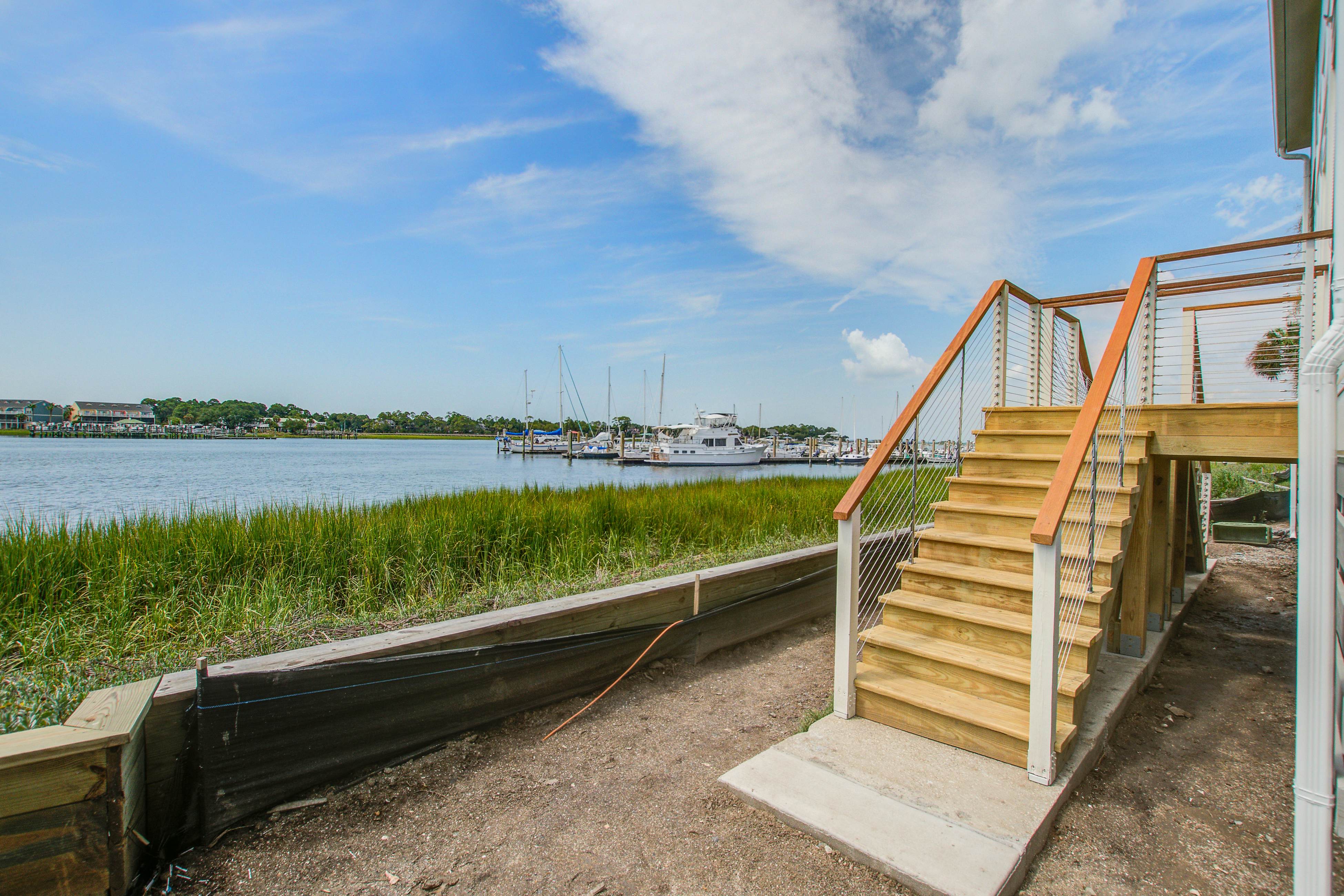 Waterfront condo with covered deck, amazing view, pool, & tennis courts