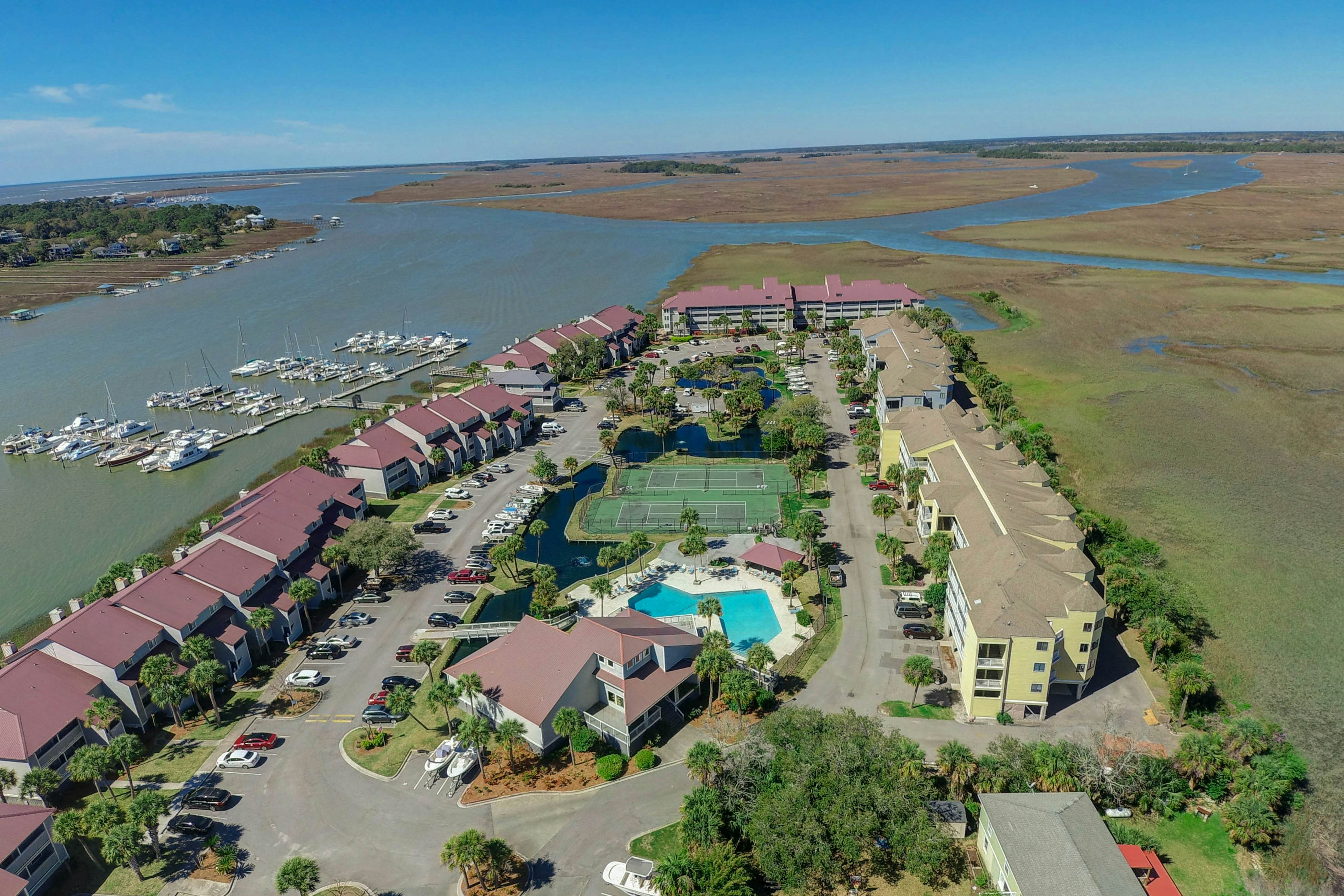 Marsh-view condo with on-site pool, tennis, & private balcony