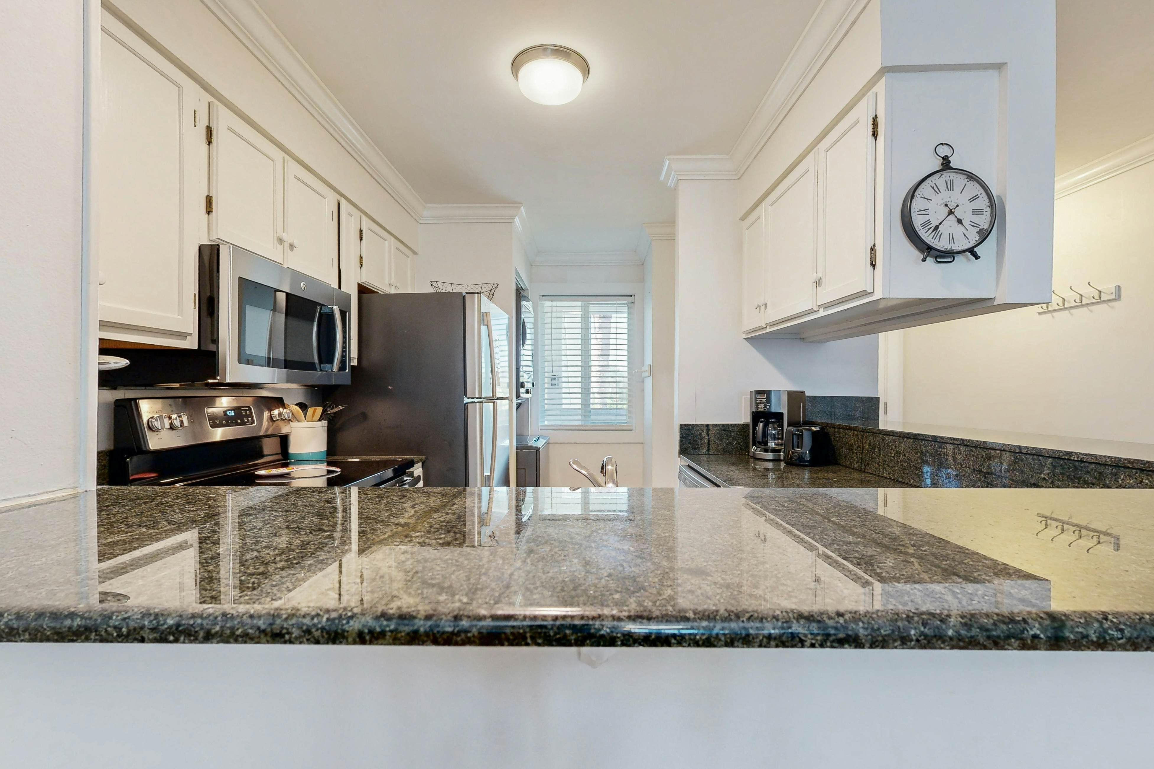 Elegant riverfront condo with access to private W/D, central AC, and pool access